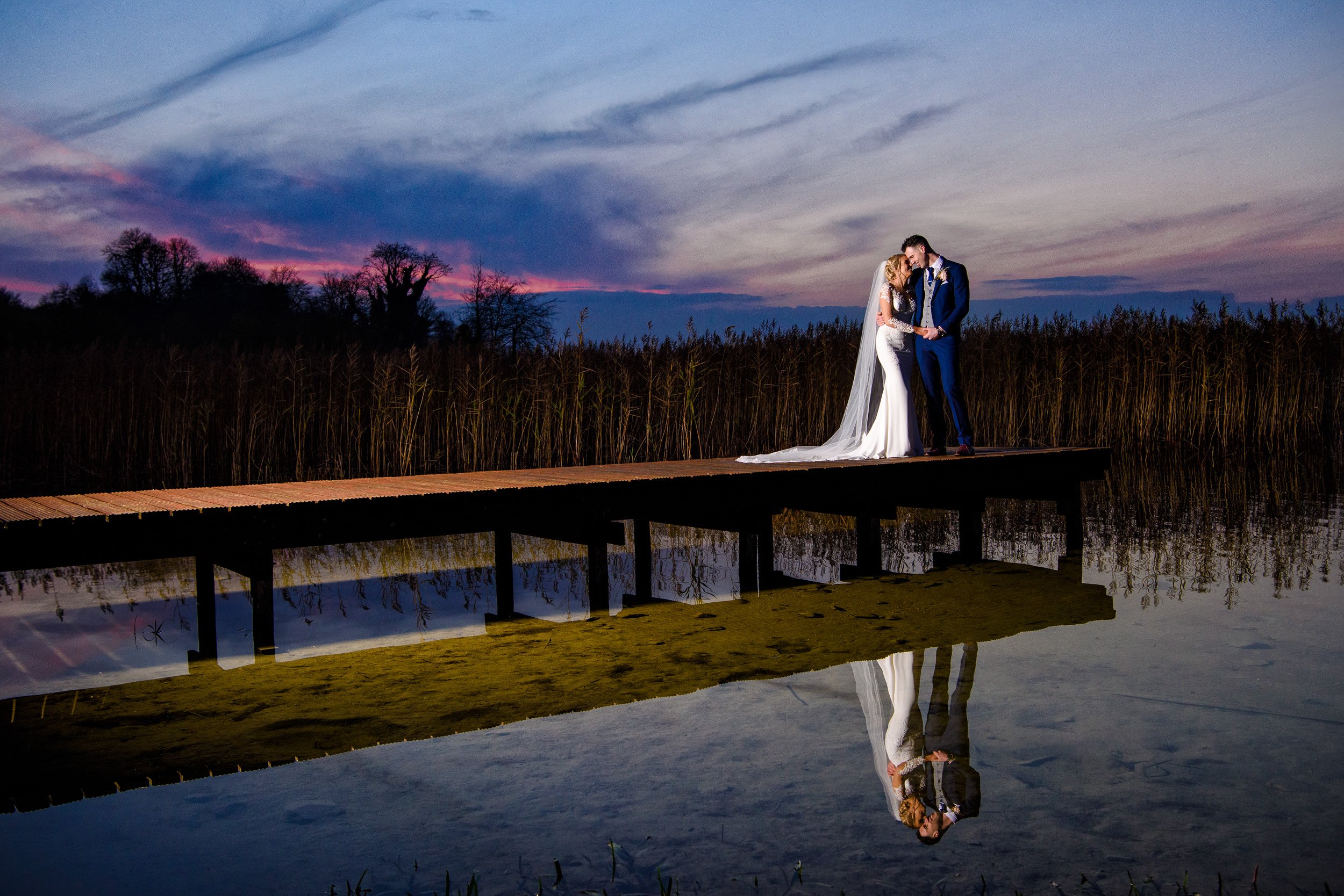 Wedding Photographer Ireland – couple on dock at sunset at Bloomfield House Hotel in Mullingar