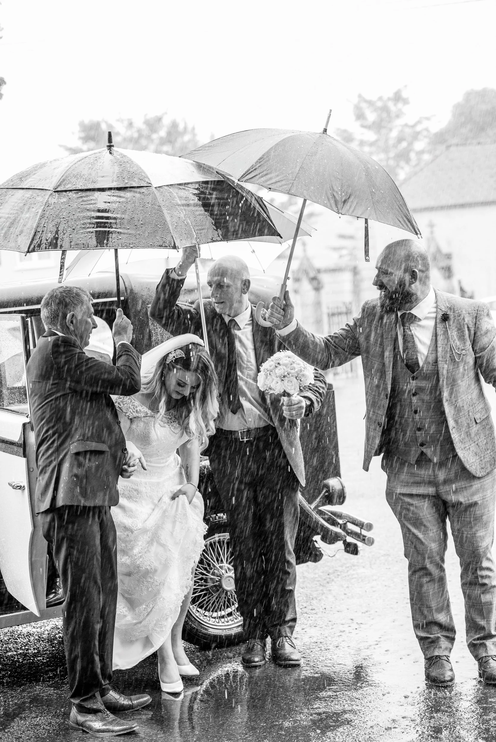 Wedding Photography Kildare – bride running in rain to ceremony at Clanard Court Hotel