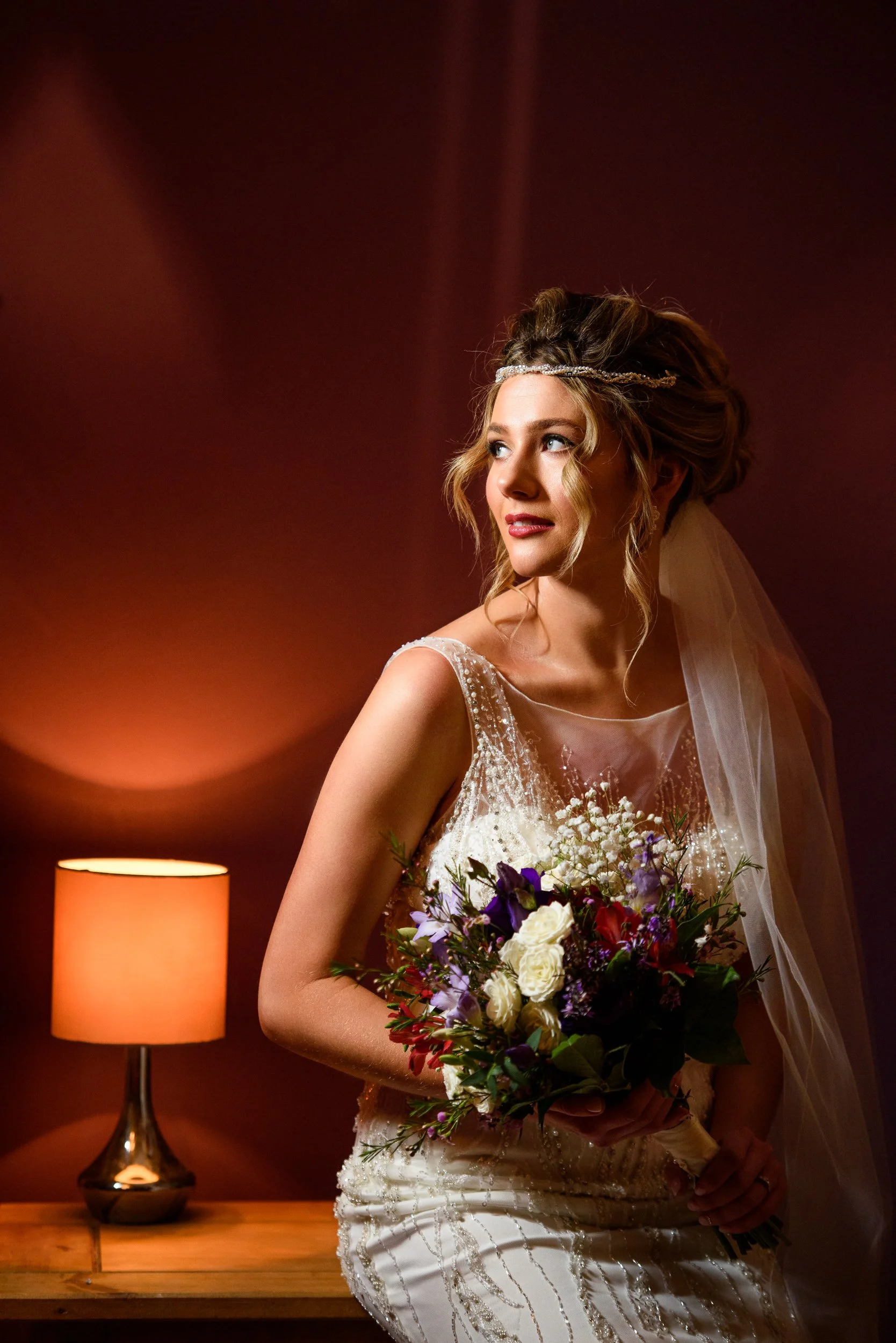 Wedding Photography Galway – bride portrait with bouquet and window light at Claregalway Hotel