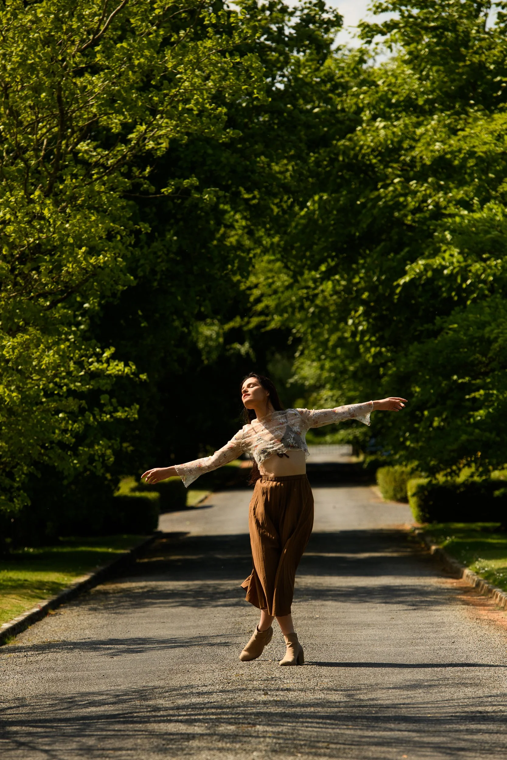 Editorial Portrait Photography Galway – woman dancing outdoors at Cloghan Castle Gort