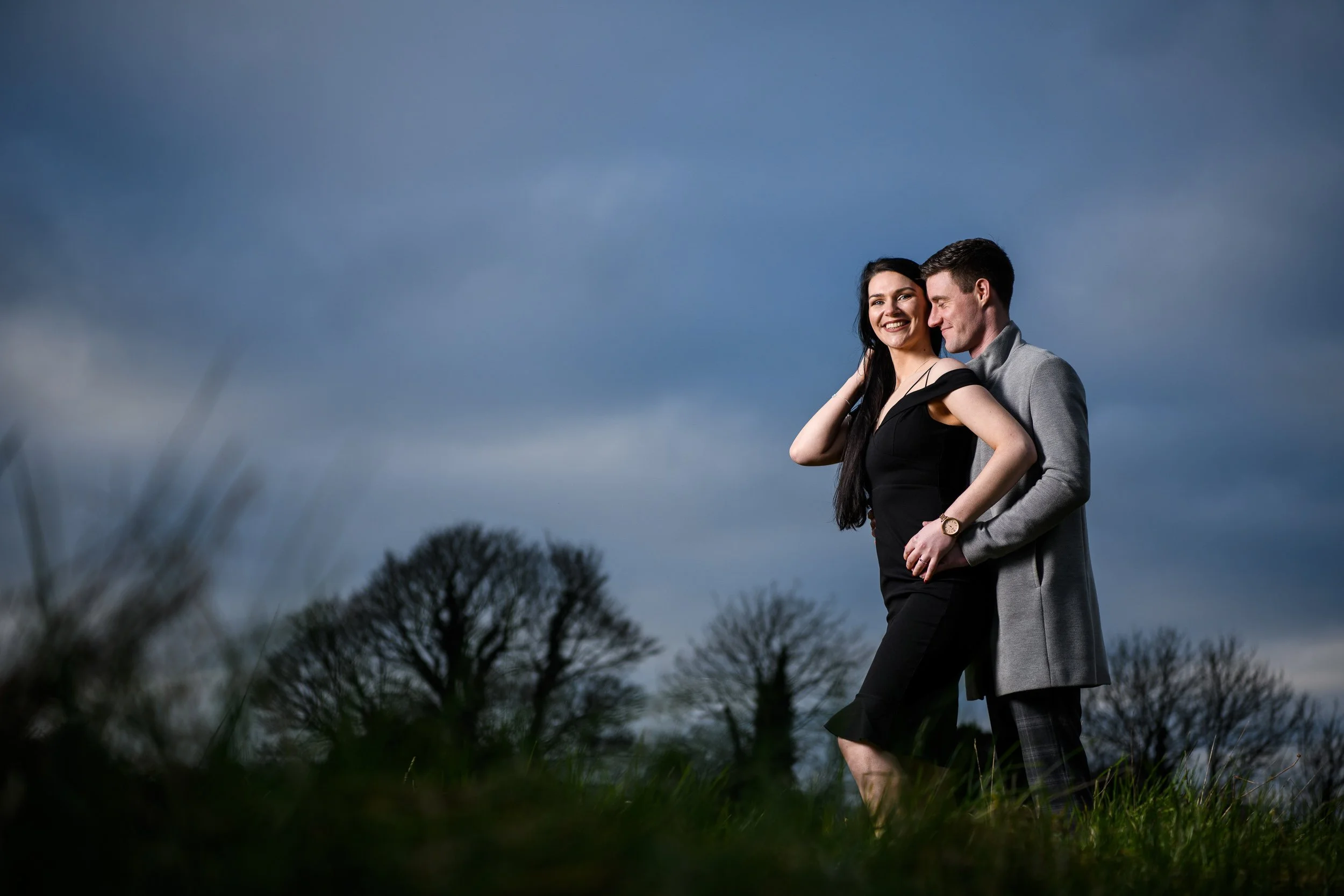 Engagement Photography Ireland – couple standing together outdoors with natural light