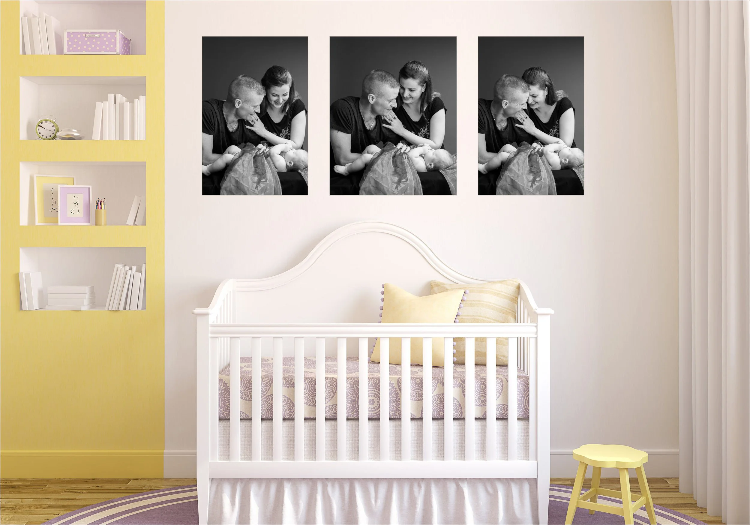 Nursery room with framed family portraits displayed above a crib.
