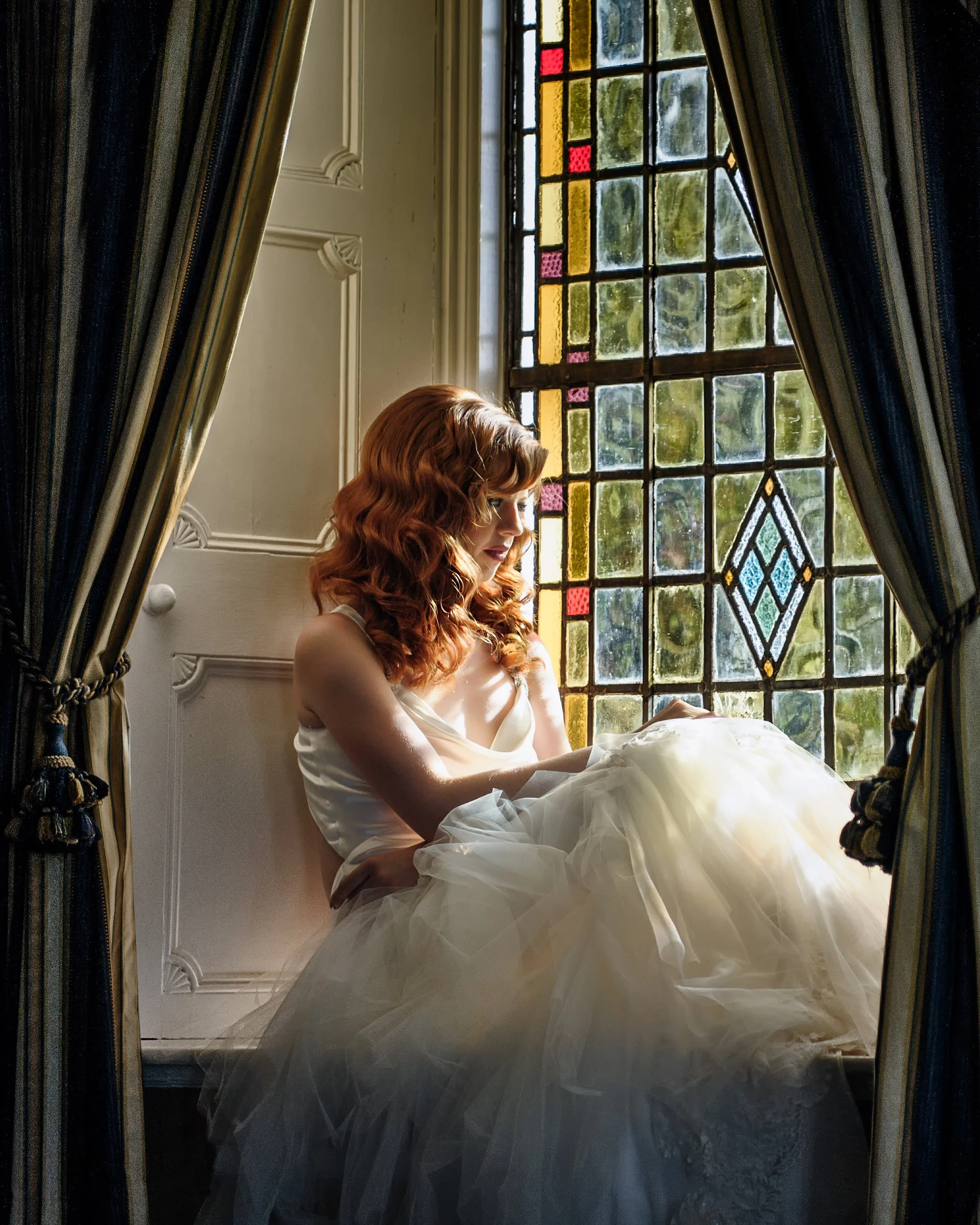 Wedding Photography Westmeath – bride portrait by stained glass window at Bloomfield House Hotel