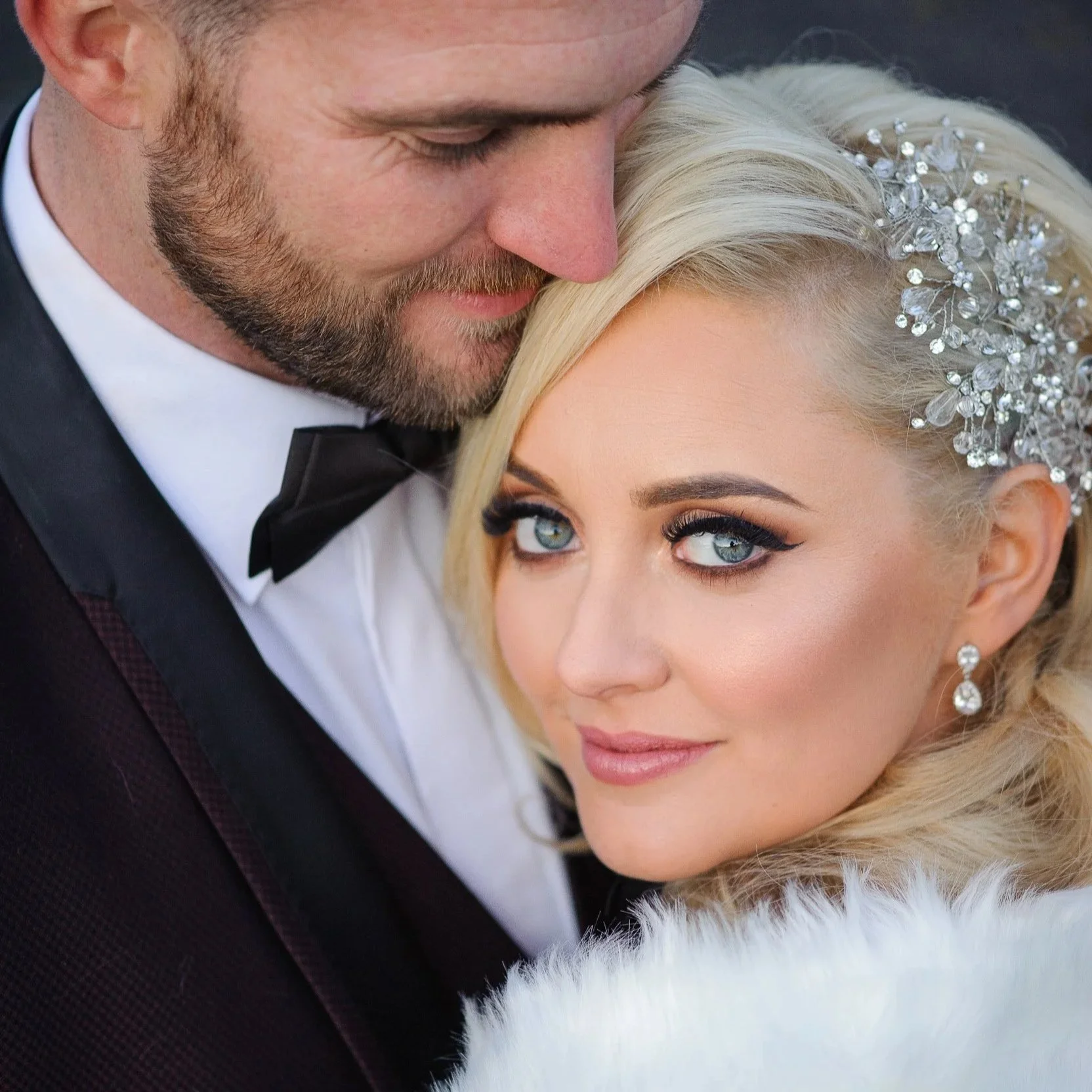 Wedding Photographer Ireland – close-up of bride and groom forehead touch with elegant styling and soft light