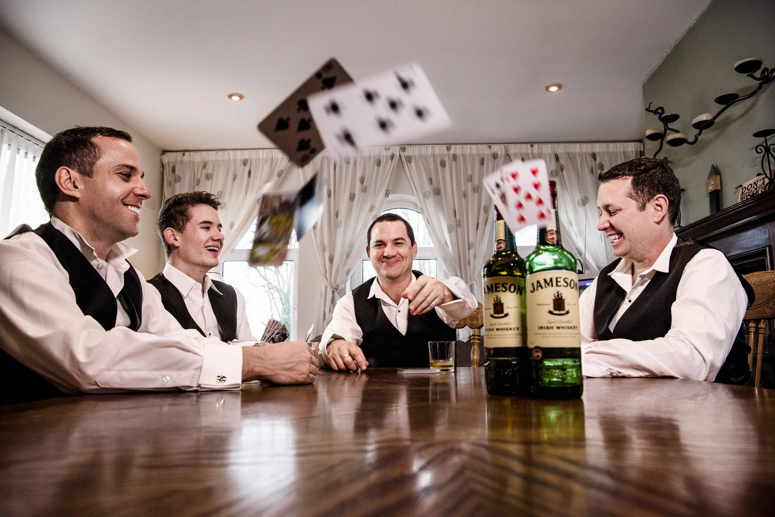 Wedding Photography Ballinasloe – groomsmen morning prep playing cards at Shearwater Hotel