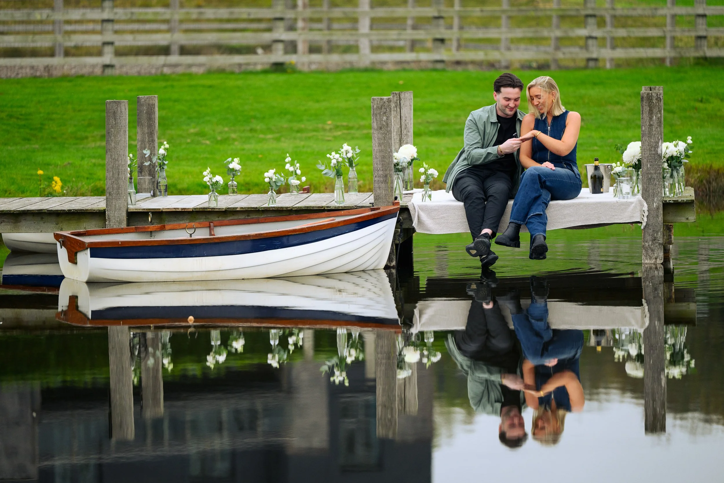 Engagement Photography Westmeath – couple on lakeside dock at Glasson Lakehouse