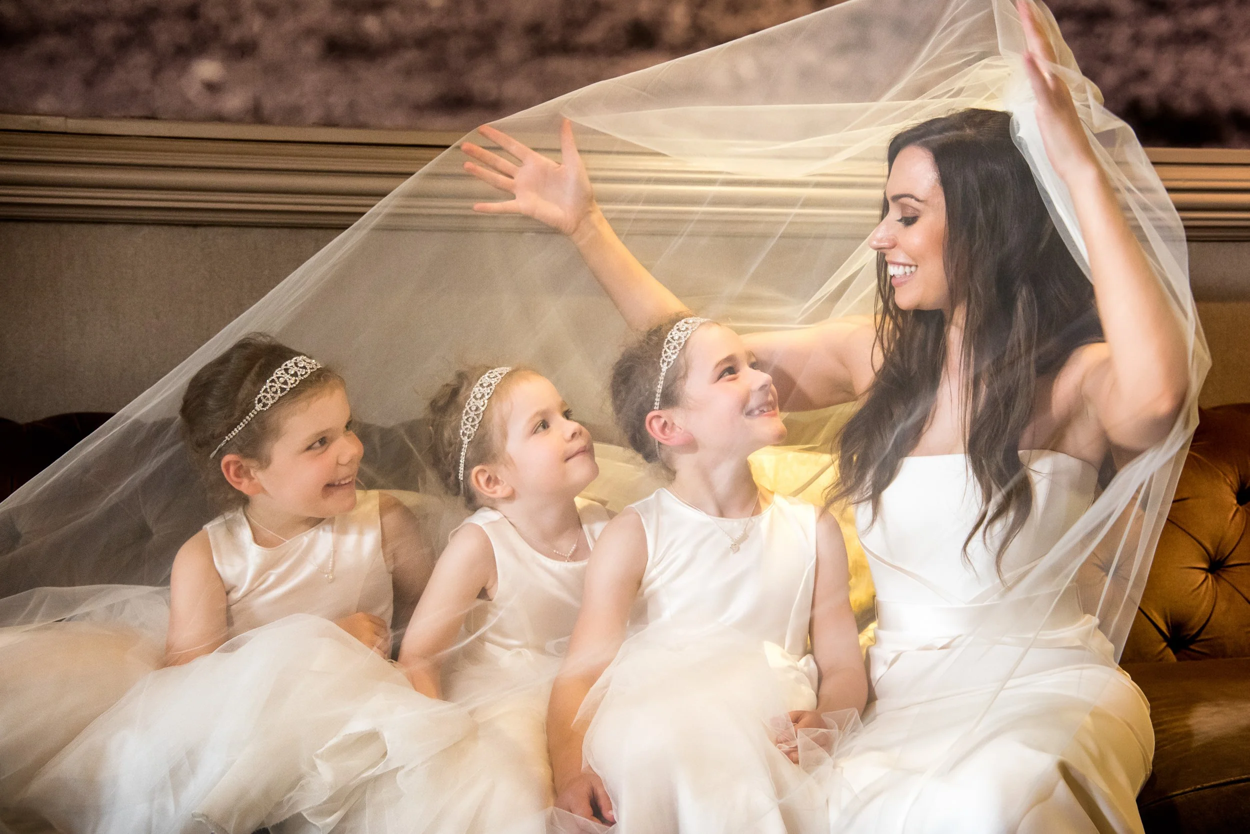 Wedding Photography Galway – bride with flower girls under veil at The Hardiman Hotel