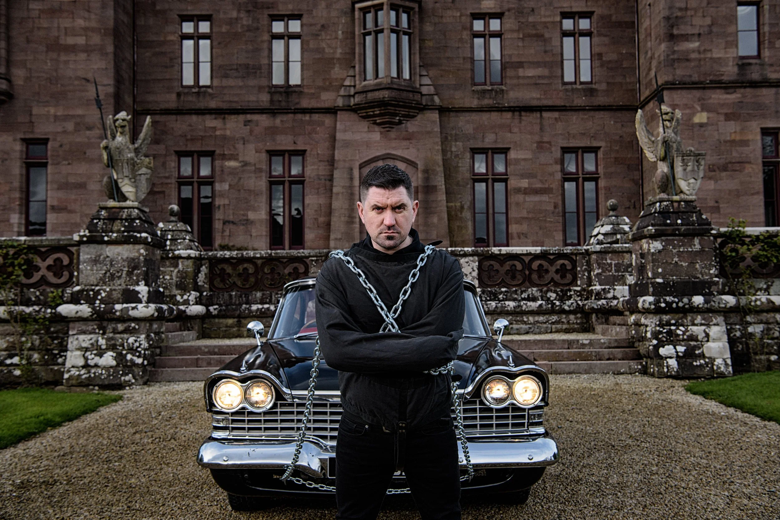 Portrait Photography Limerick – portrait with vintage car and chains at Castle Oliver