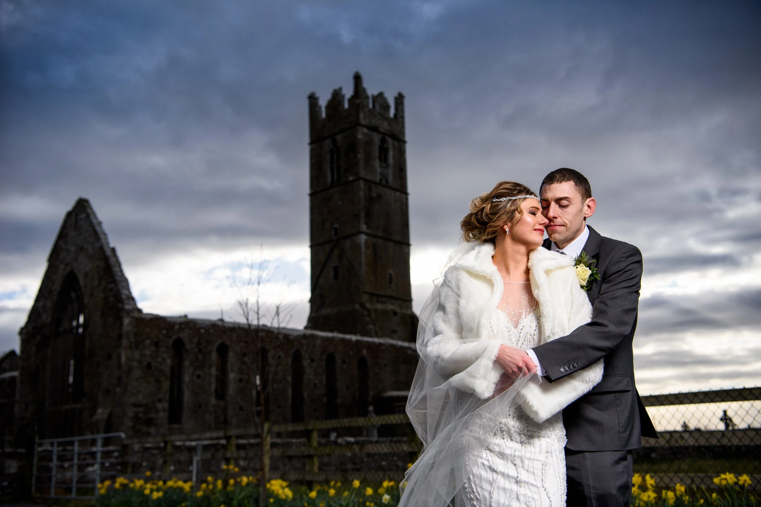 Wedding Photography Galway – couple portrait at Claregalway Abbey with dramatic sky