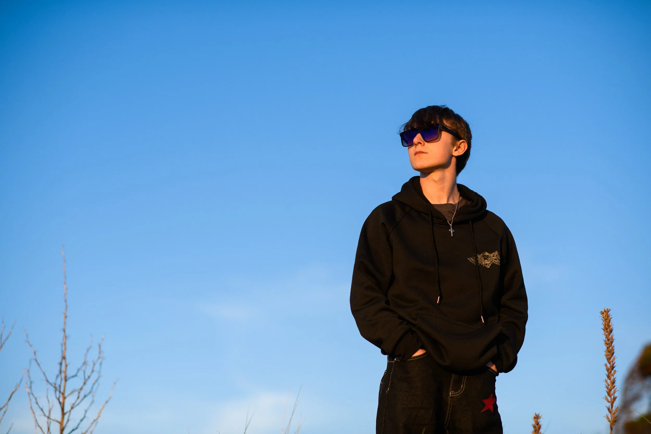 Portrait Photography France – outdoor portrait against blue sky in Normandy