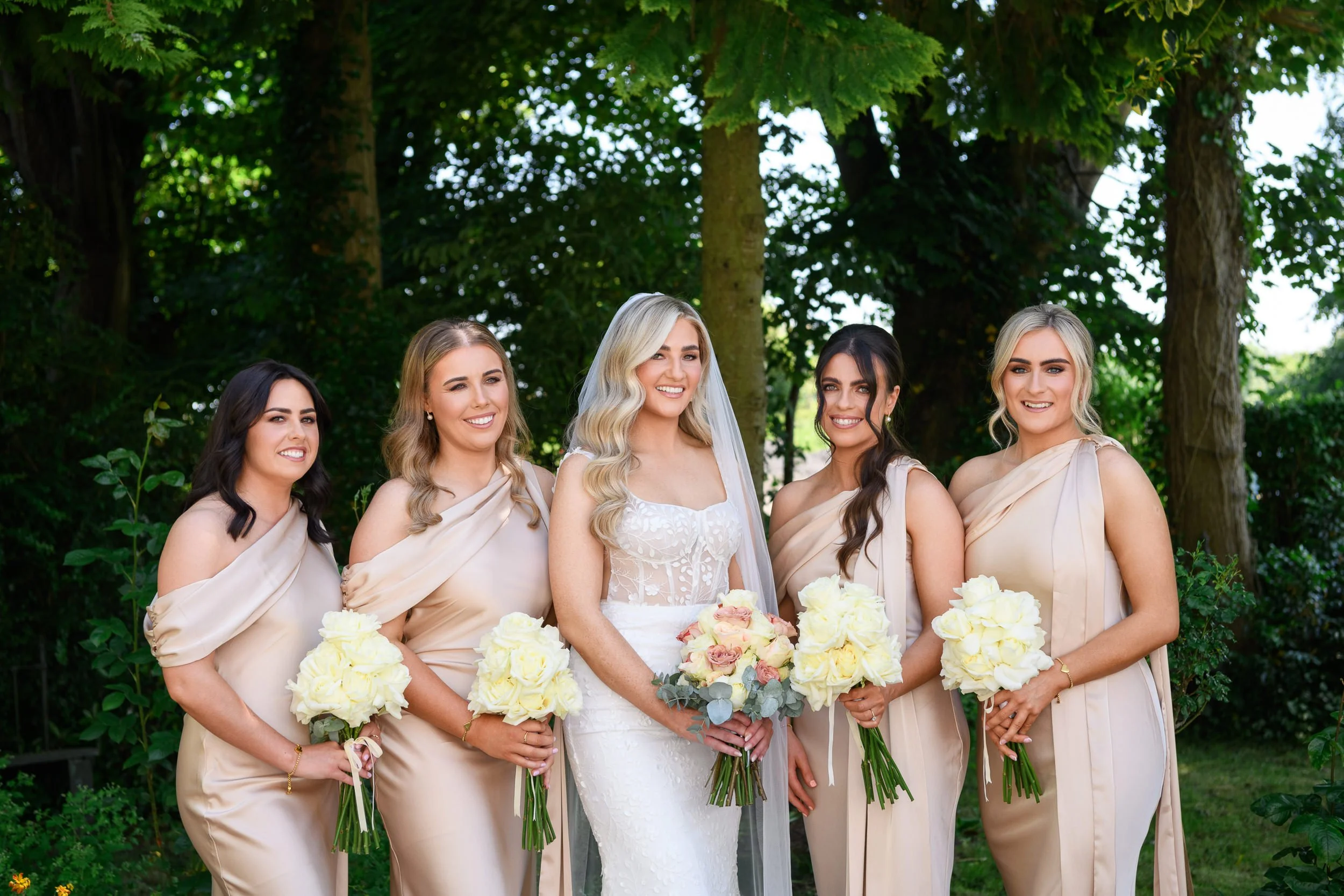 Wedding Photography Westmeath – bride and bridesmaids group portrait outdoors at Glasson Lakehouse