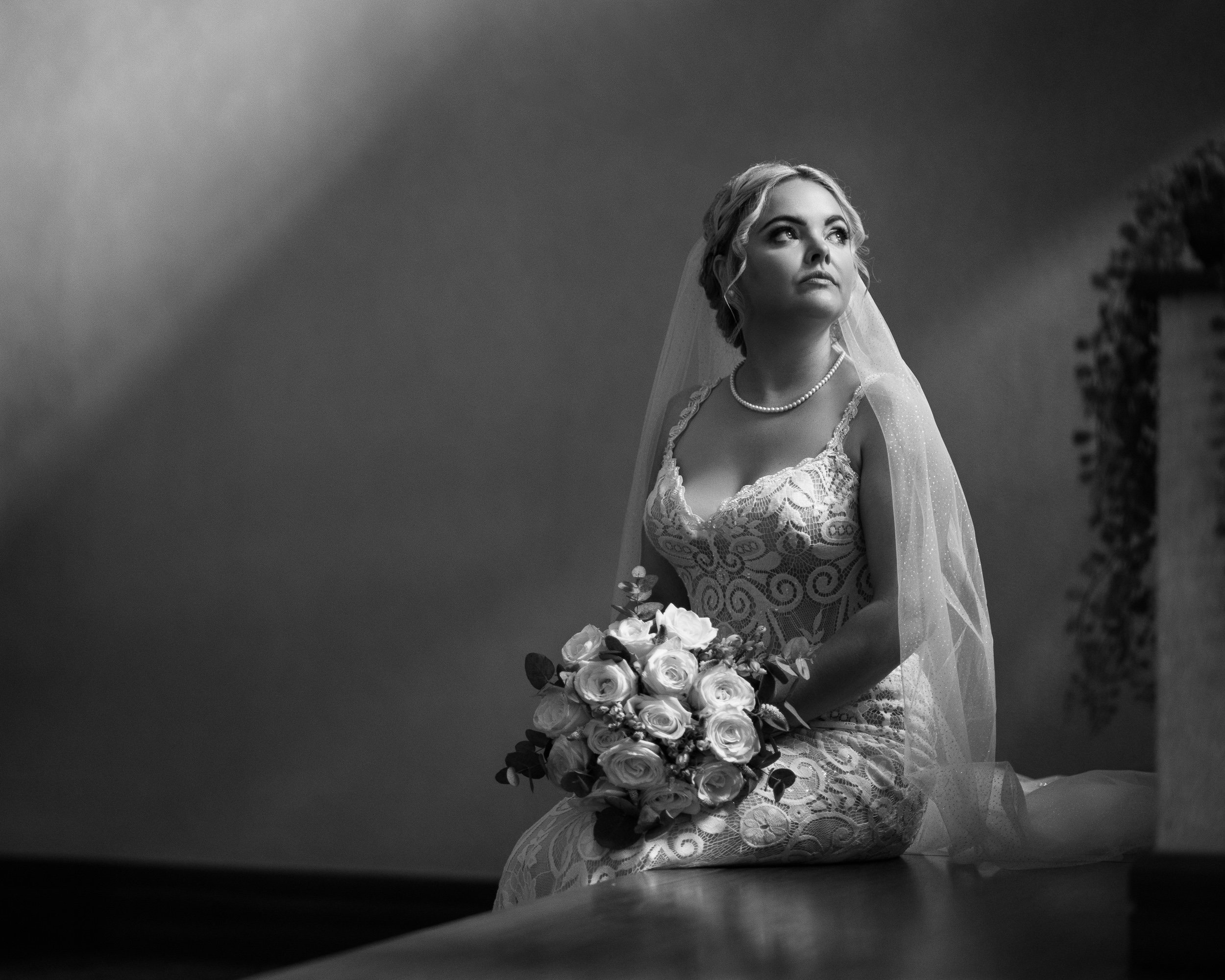 Wedding Photography Tullamore – black and white bride portrait with staircase light at Court Hotel