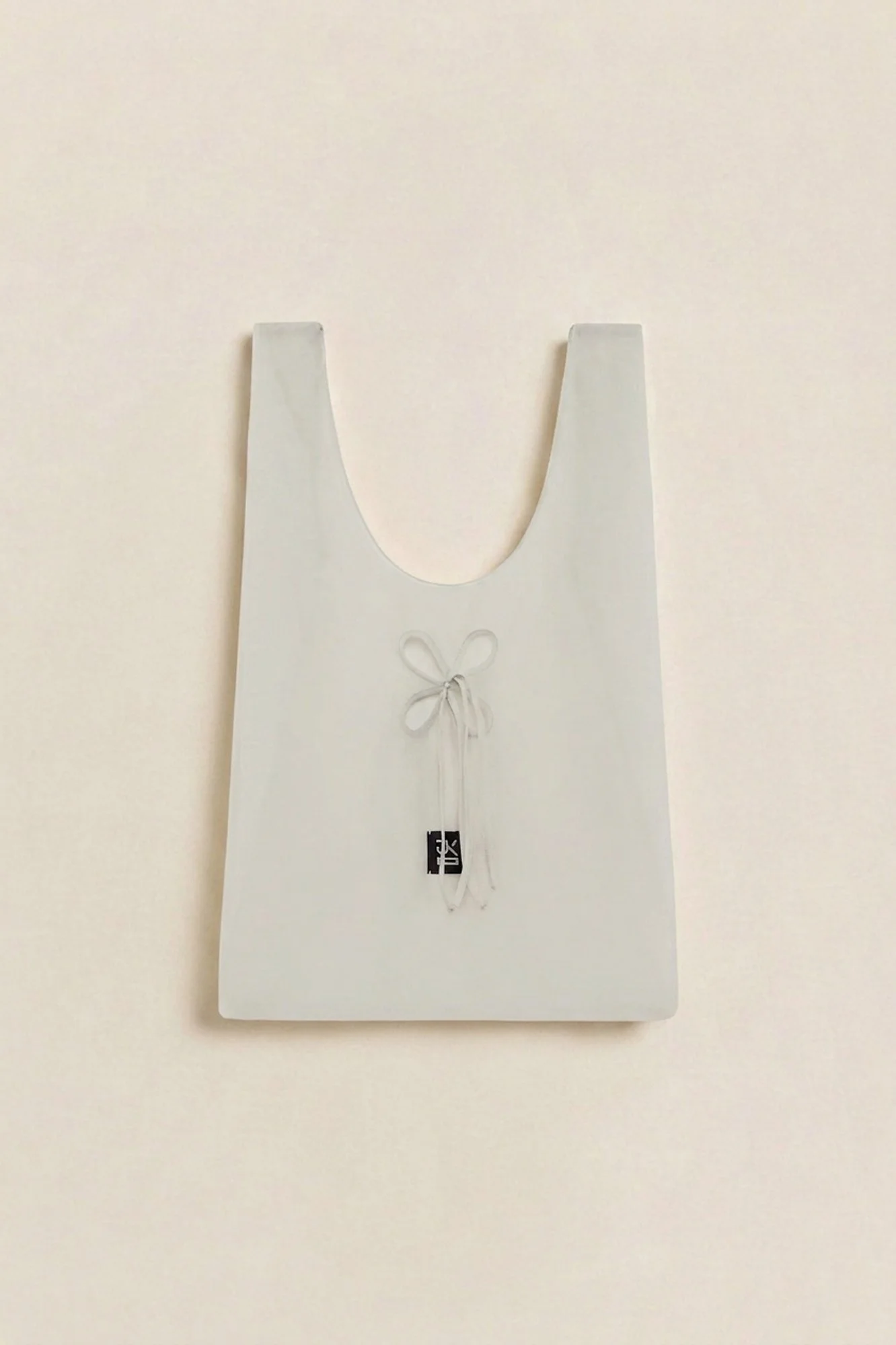 J.Kim petal tote in light green, flat image of the sheer tote bag with petal cut-out detail