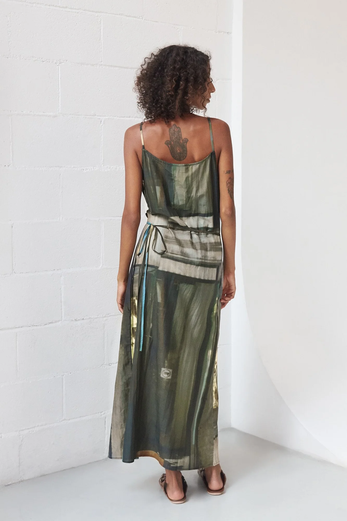 Mouzahres Venezia wrap dress in multi, back view showing the sleeveless wrapped maxi silhouette and printed pattern