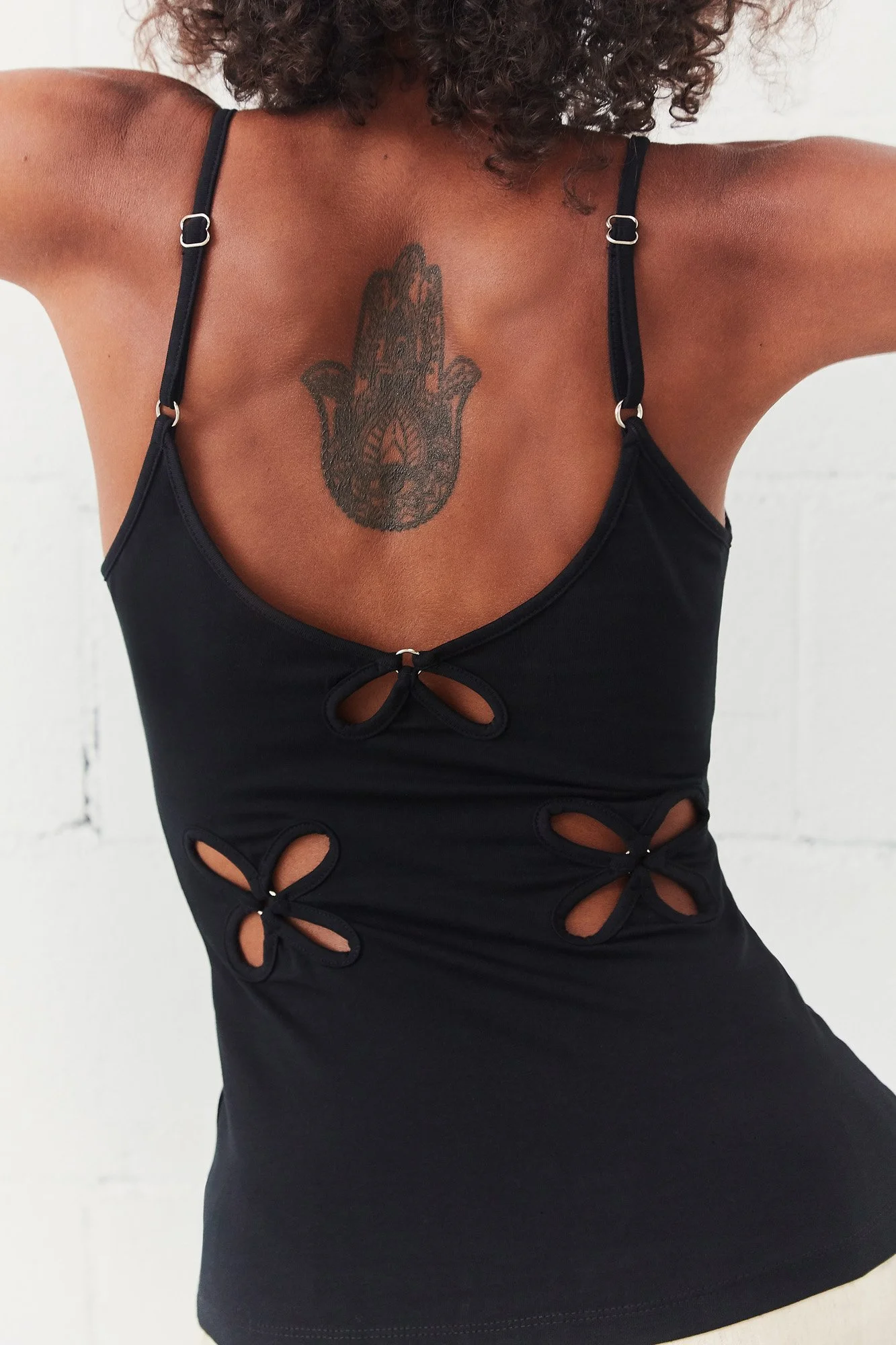 J.Kim Chilla camisole in black, close-up of the neckline and adjustable straps with floral cut-out detail