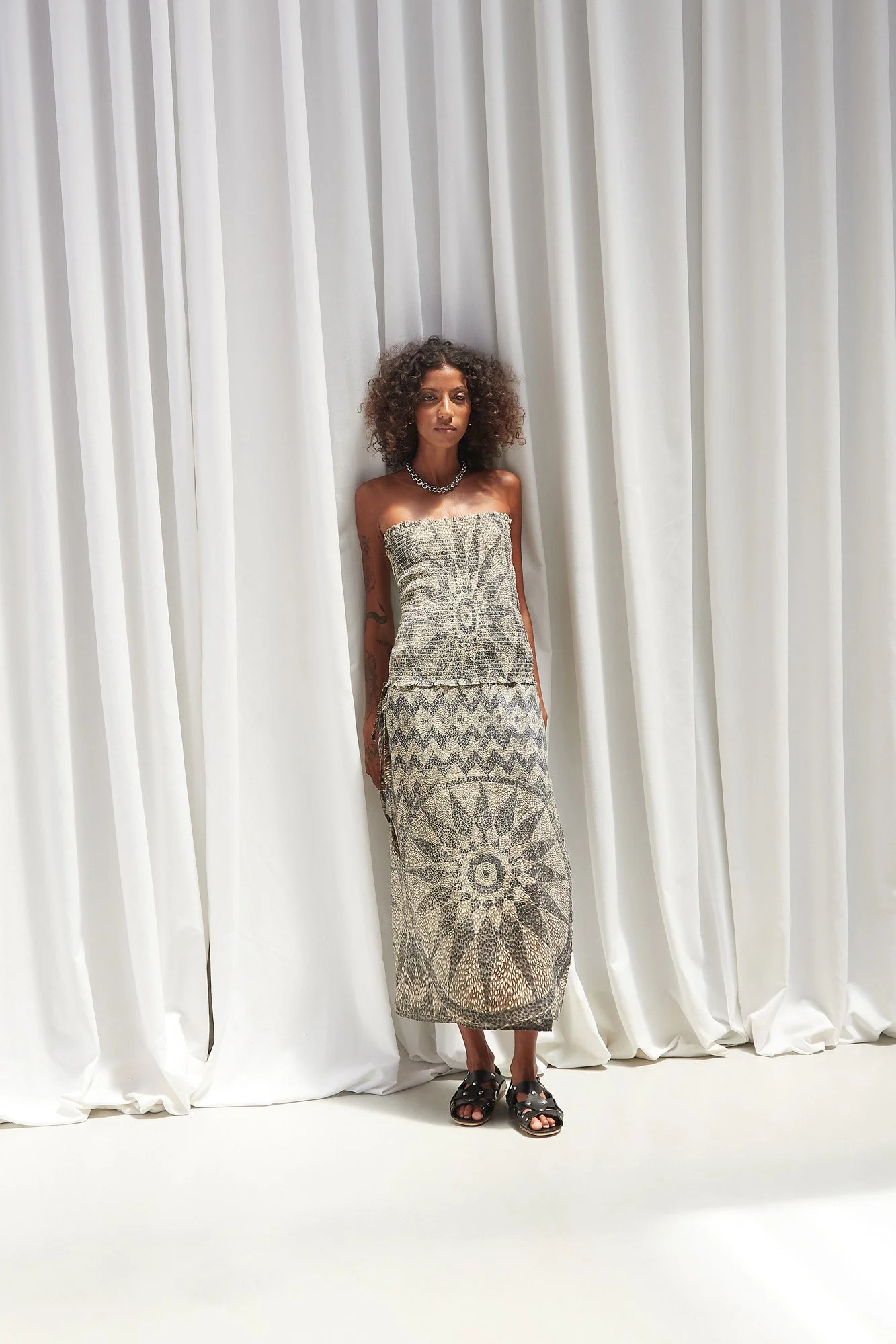 Mouzahres bandeau top in multi, full-length front view of the strapless bandeau top with geometric mosaic print