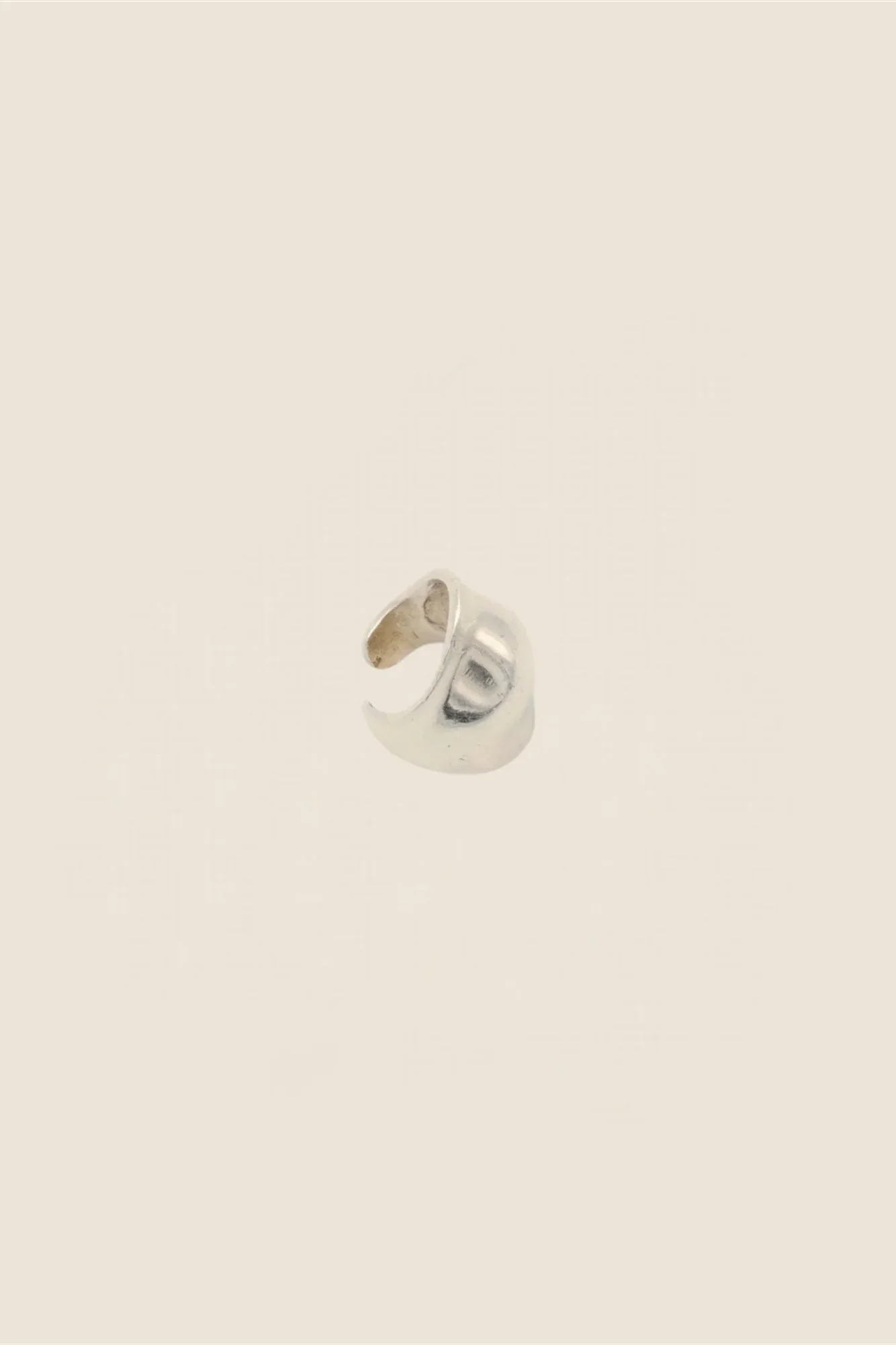 Anicet Goutte Ear Cuff from the side, showing the open back of the polished silver ear cuff