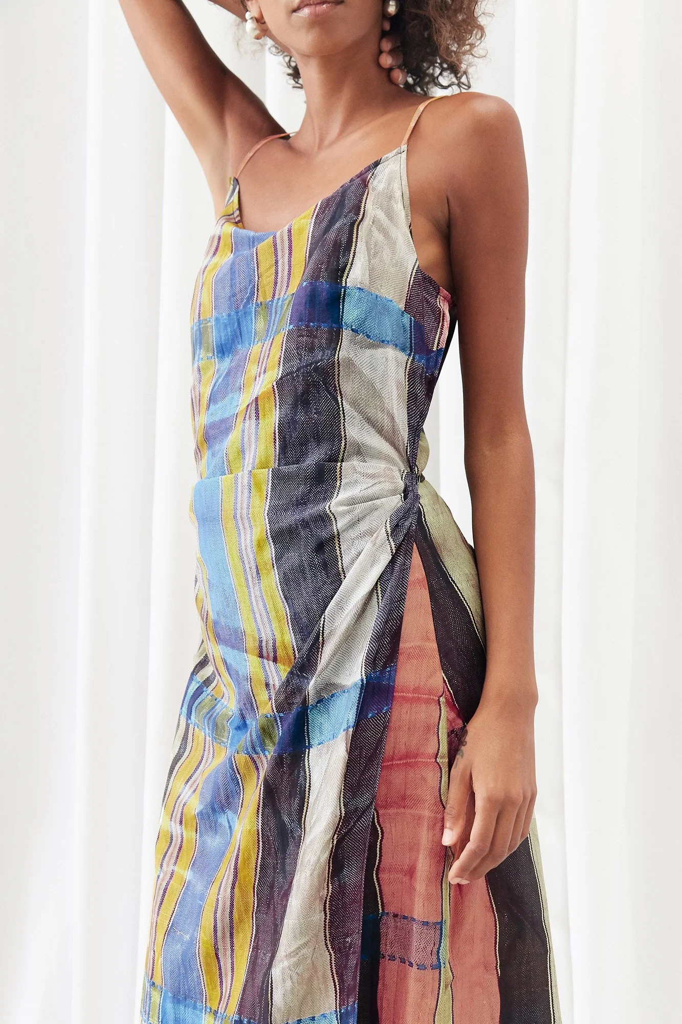 Mouzahres Zosma wrap dress in multi, close-up of the thin straps and abstract striped print with wrapped side detail