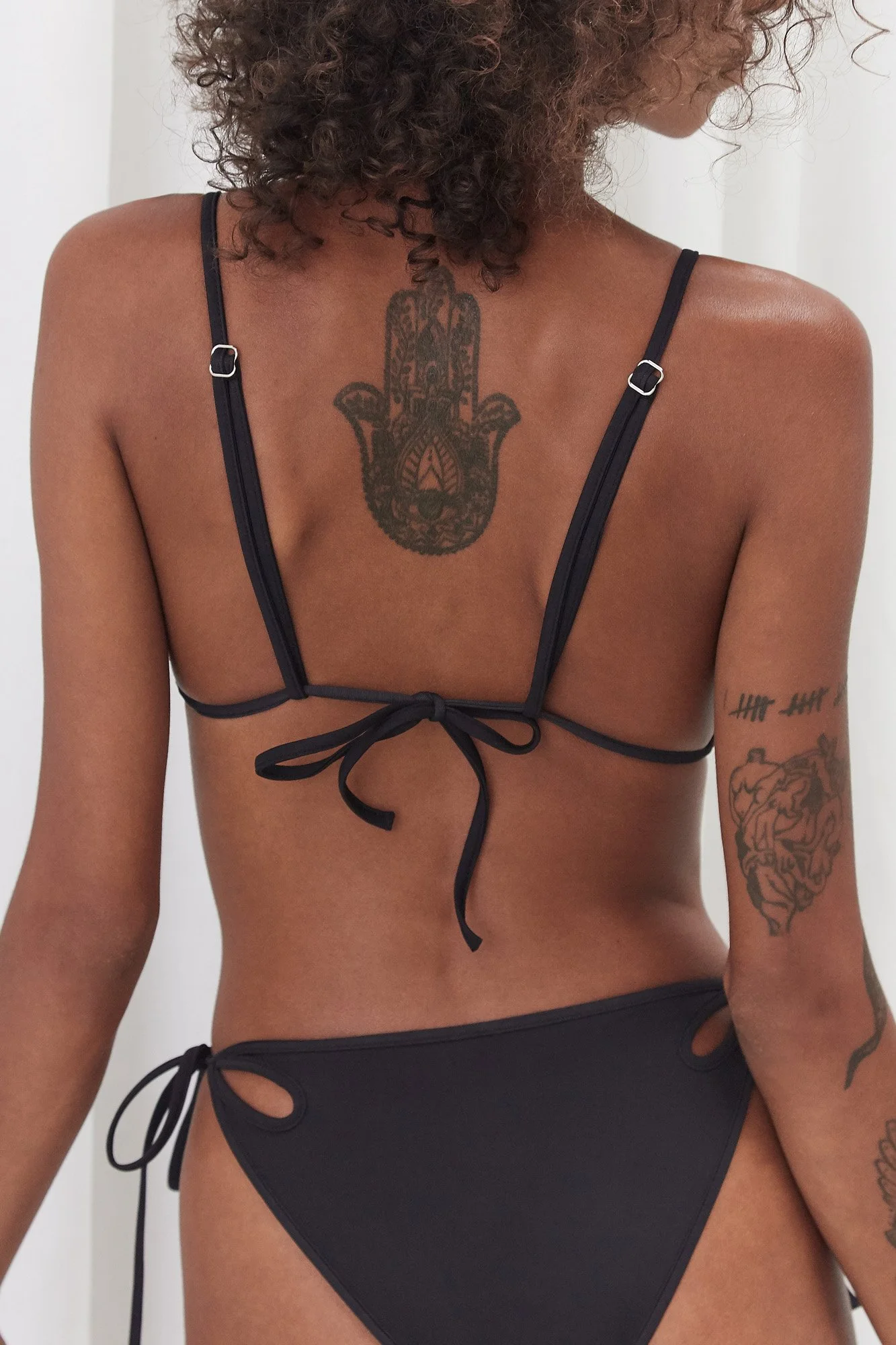 J.Kim Chilla bikini top in black, back view showing the halter tie fastening