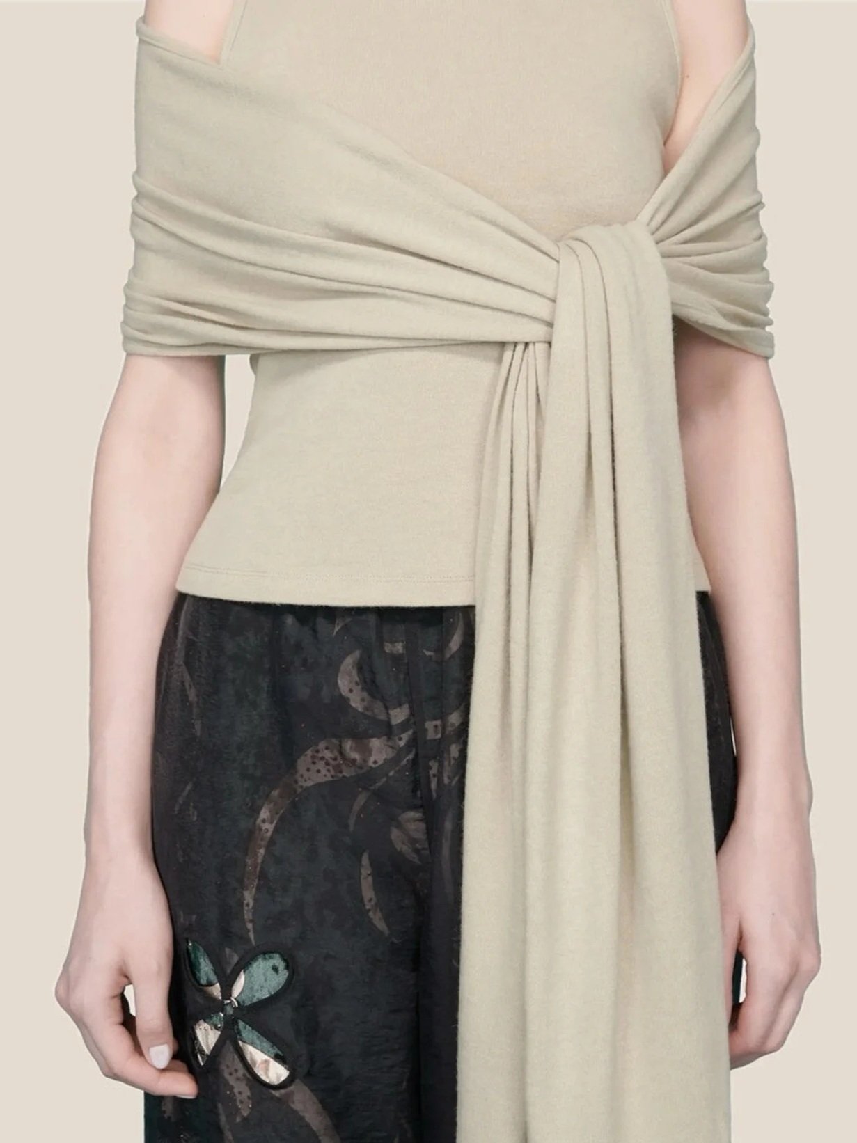 Front detail J.Kim sleeveless halter knit top in light sage with an attached shawl draped over the shoulders and tied in a long knot at the front