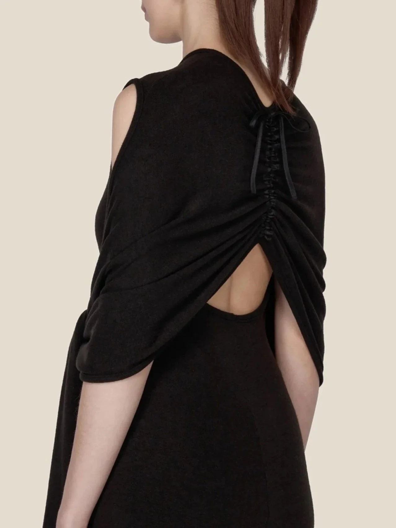 J.Kim black halter knit dress, side back view showing the adjustable drawcord gathering and low rounded back opening