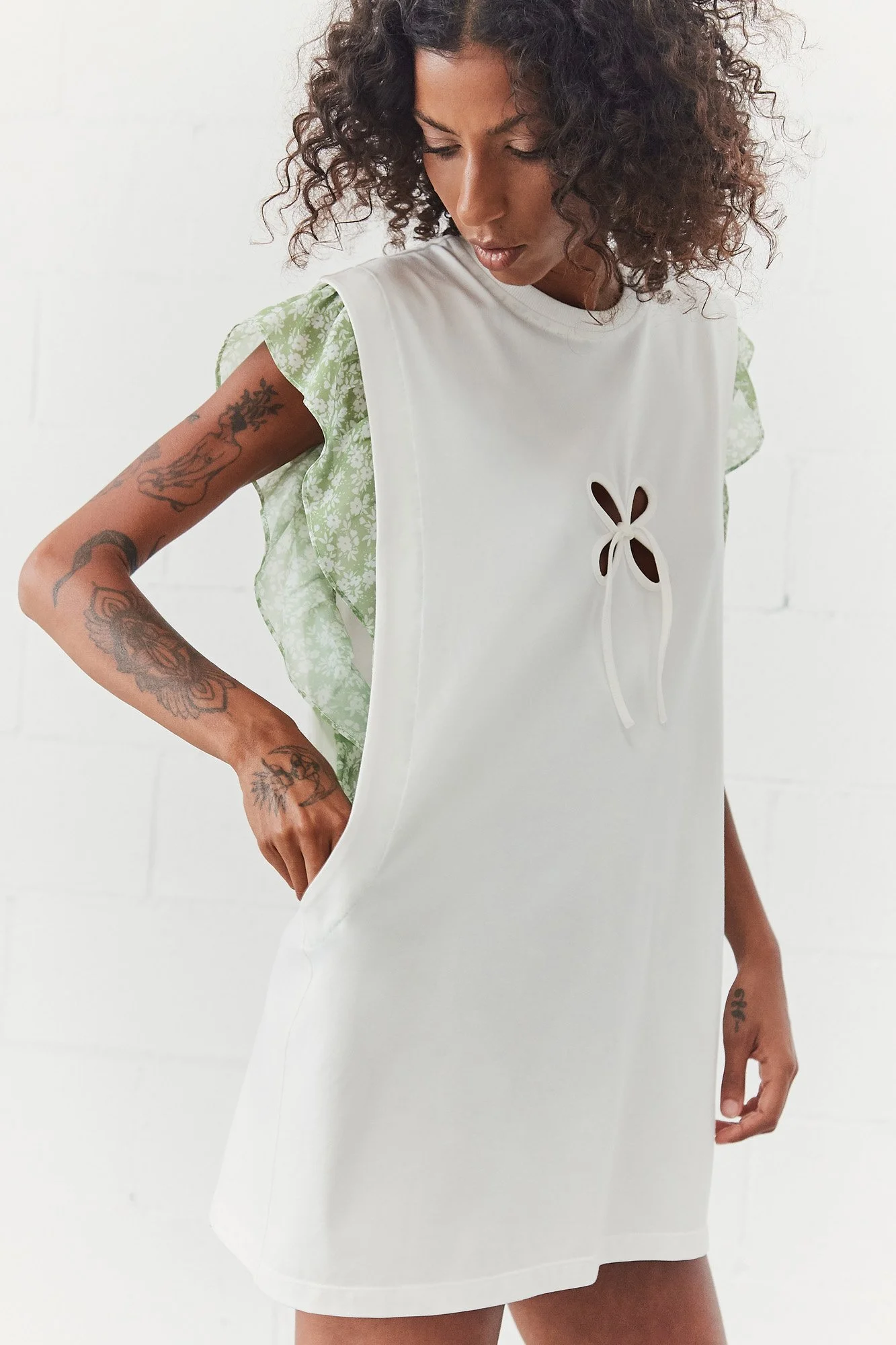 J.Kim Anechka petal t-shirt in white with green floral ruffle sleeves, front view showing petal cut-out at the chest