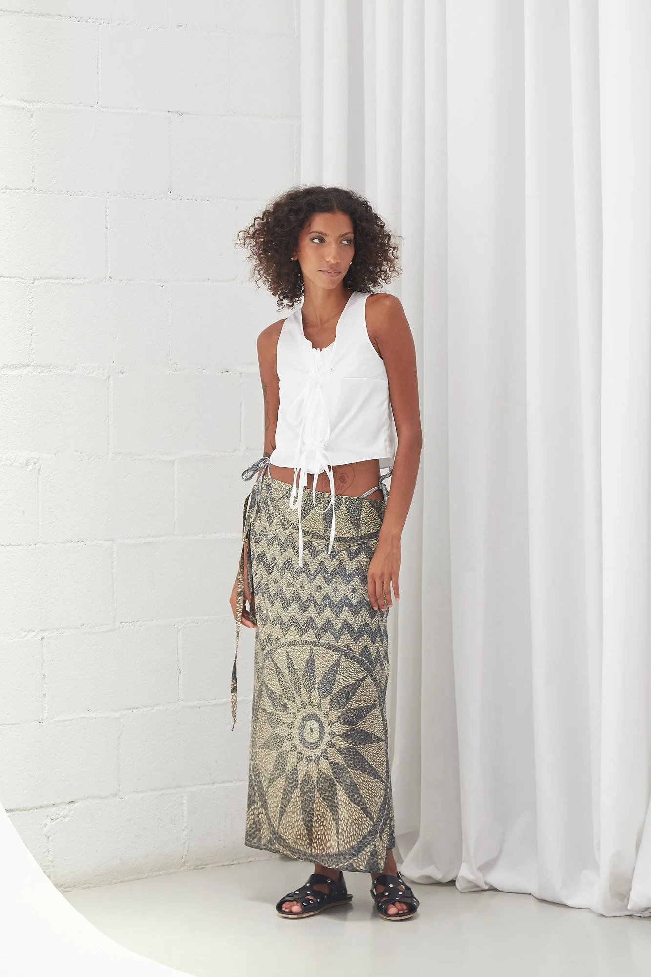 Mouzahres wrap skirt in multi, full-length front view of the wrapped maxi skirt styled with an Intellectual Leisure white tie top