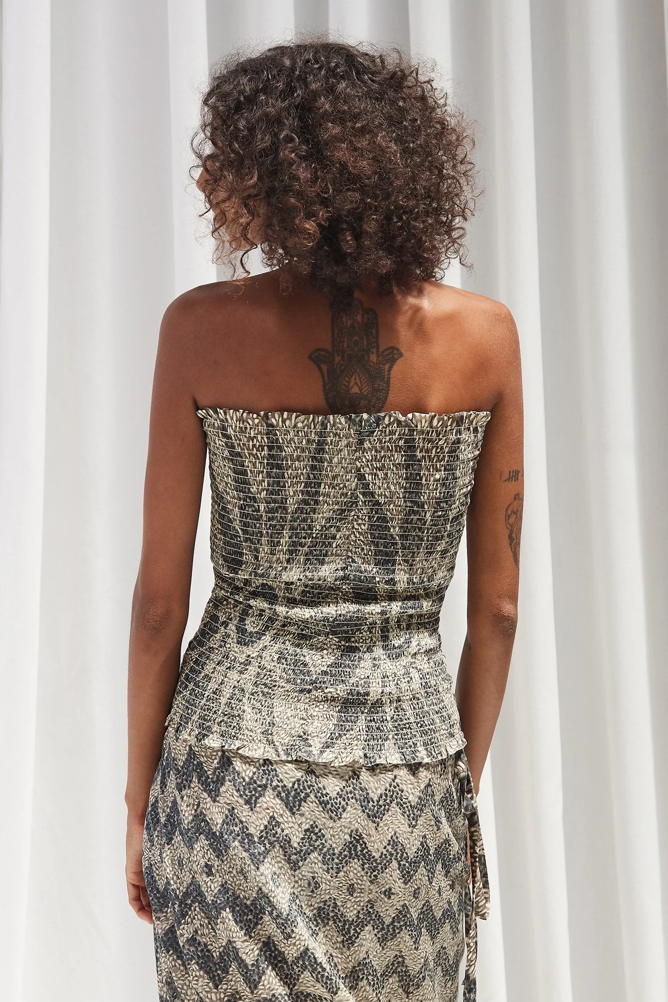 Mouzahres bandeau top in multi, back view showing the strapless fitted cut and geometric mosaic print