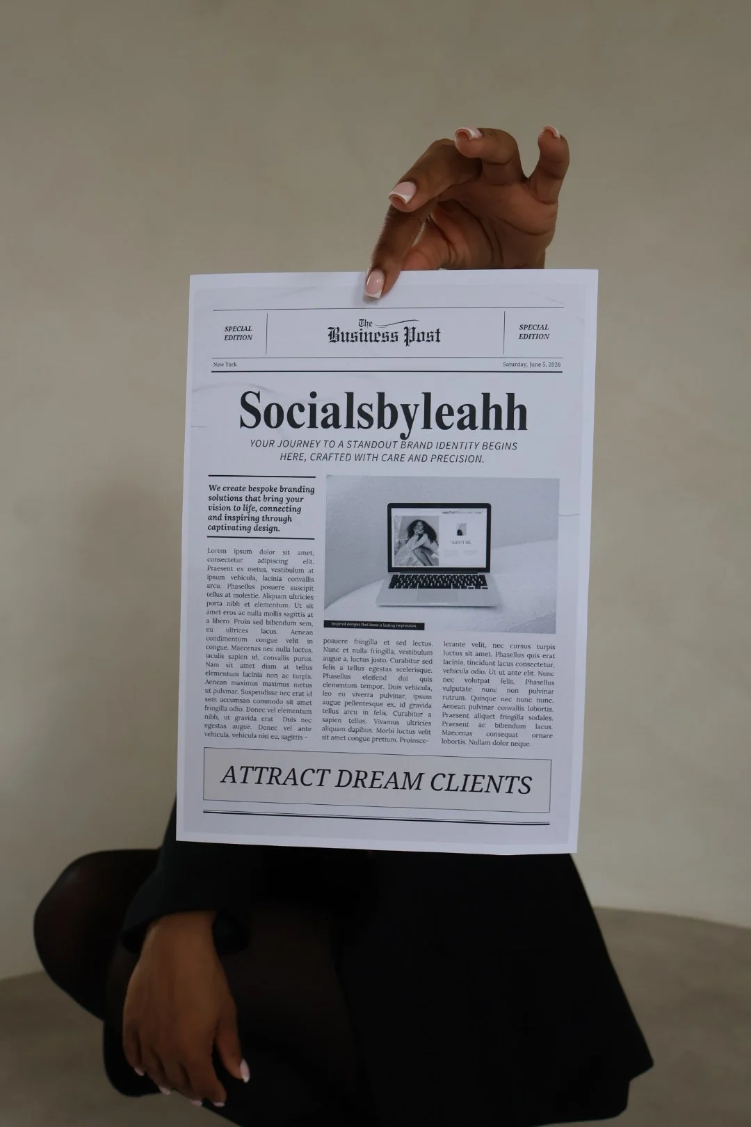 A person sitting down holding a newspaper titled 'The Business Post' with a headline 'Socialsbyleahh' and a message 'ATTRACT DREAM CLIENTS' at the bottom.