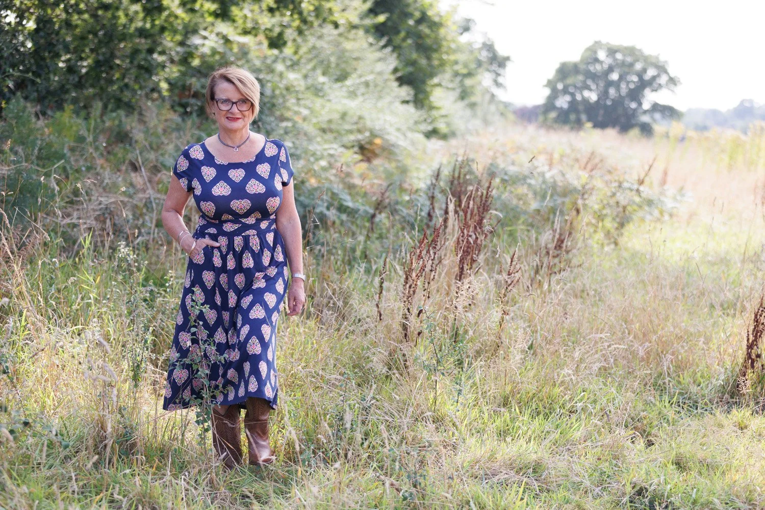 Rachel Williams walking through a field