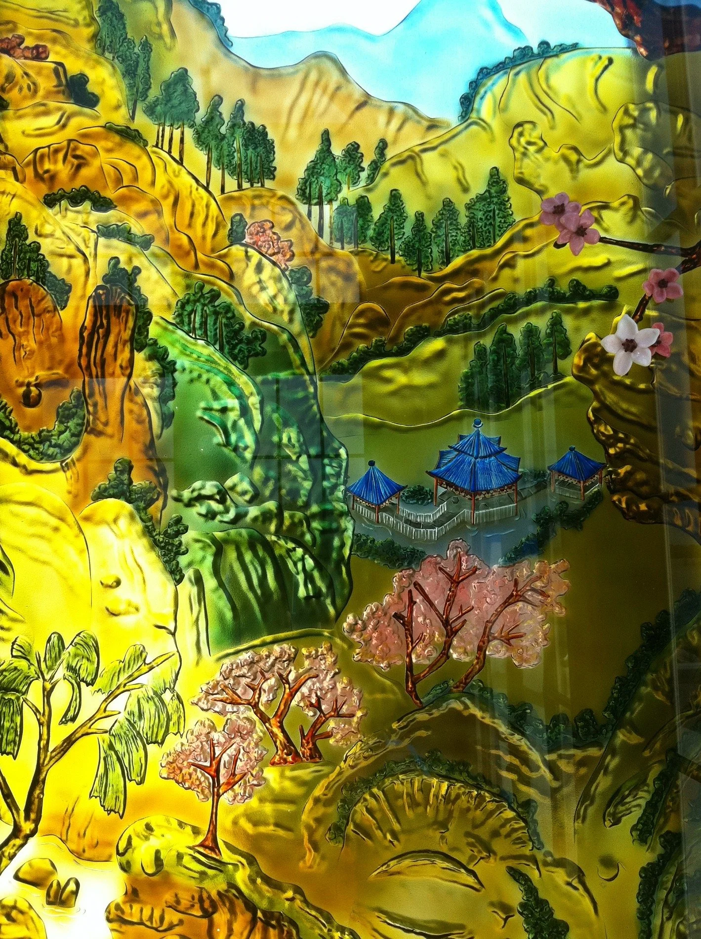 An image of The Float House deeply carved into glass
