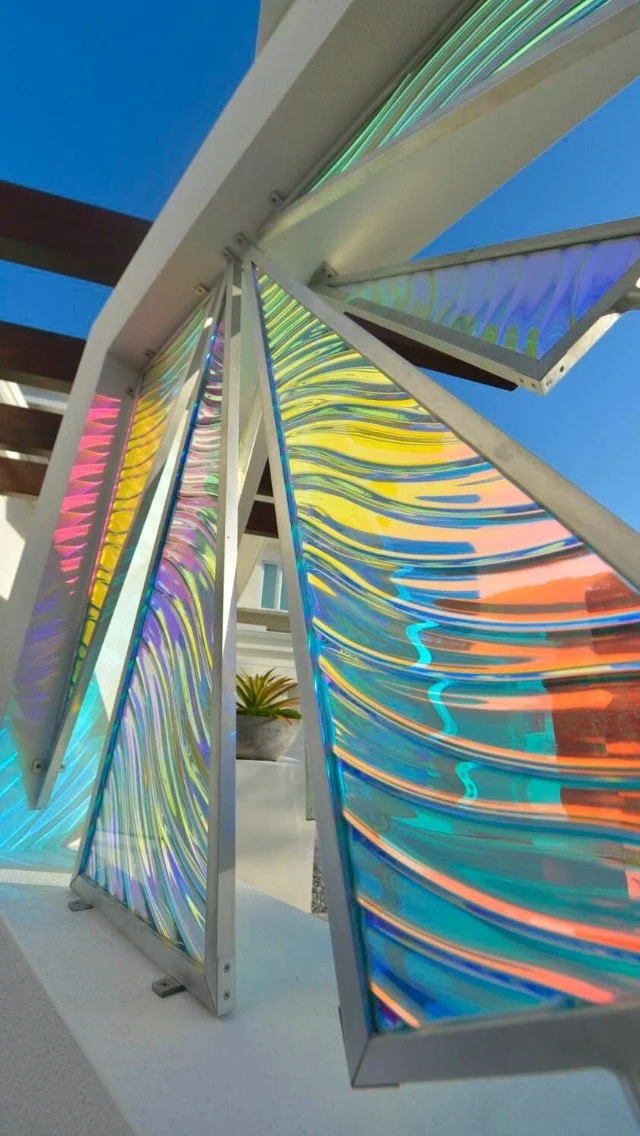 A close up of outdoor textured dichroic glass panels 