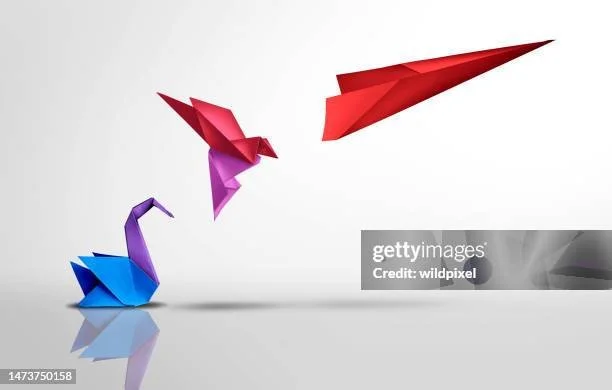 Colorful paper origami animals, including a blue swan, purple bird, and red bird, on a white background.