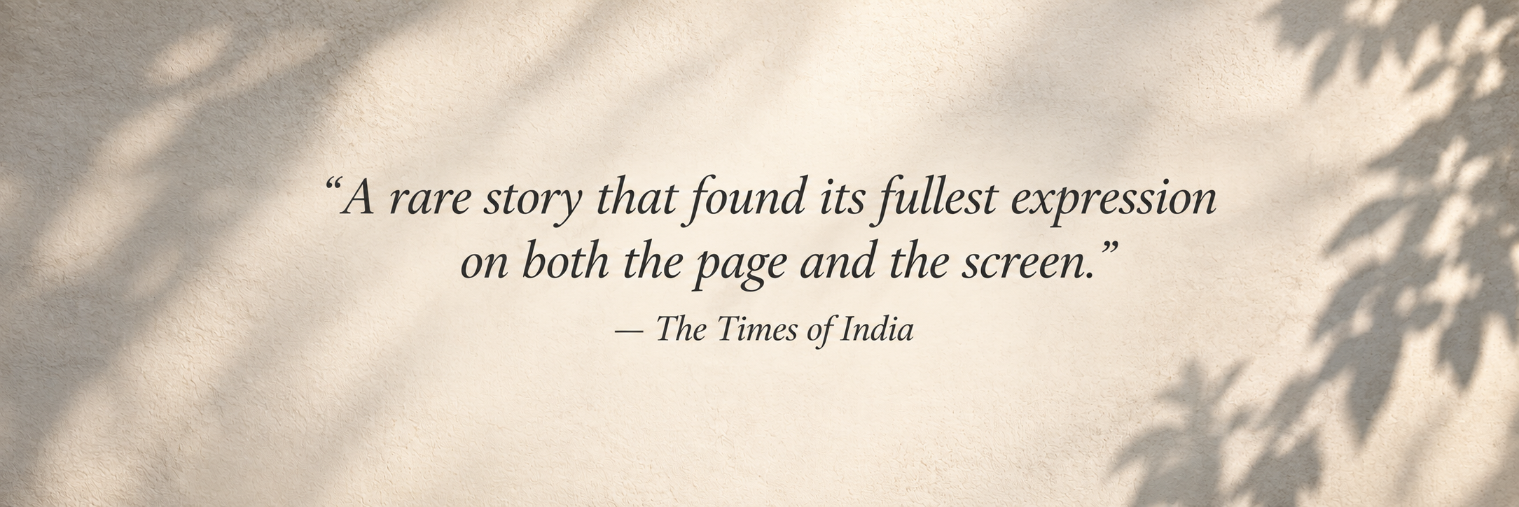 A quote on a textured beige background reads, 'A rare story that found its fullest expression on both the page and the screen,' attributed to The Times of India, with shadows of leaves on the right side.