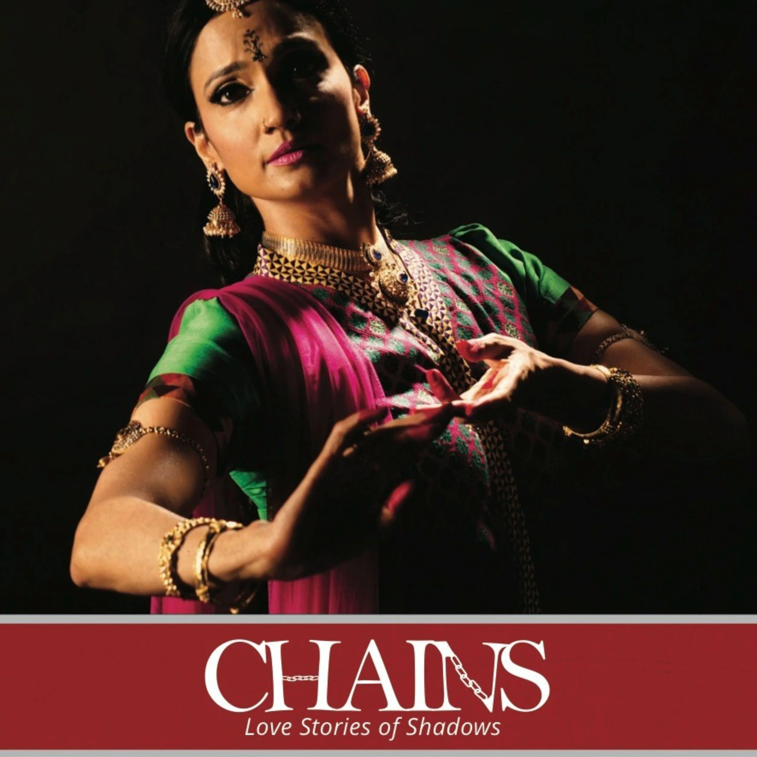 A woman dressed in traditional Indian attire with jewelry, posing with a hand gesture, against a black background. The bottom features a red banner with the title 'CHAINS' and the subtitle 'Love Stories of Shadows'.