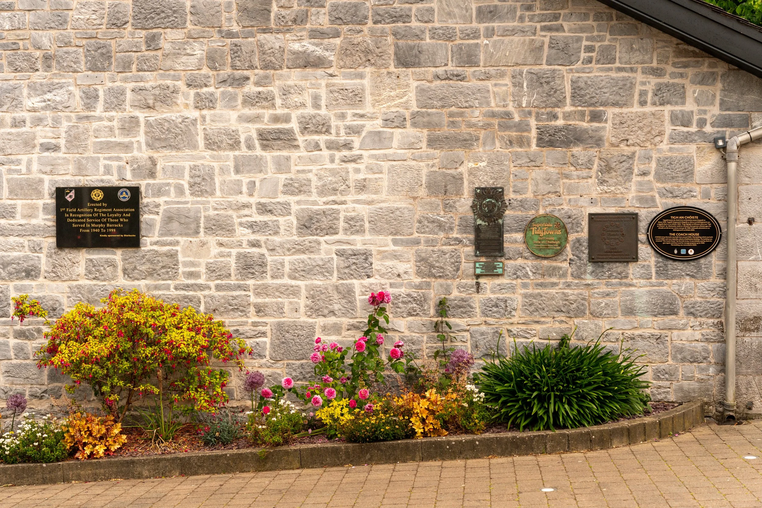 Commemorative plaques on stone building in Ballincollig