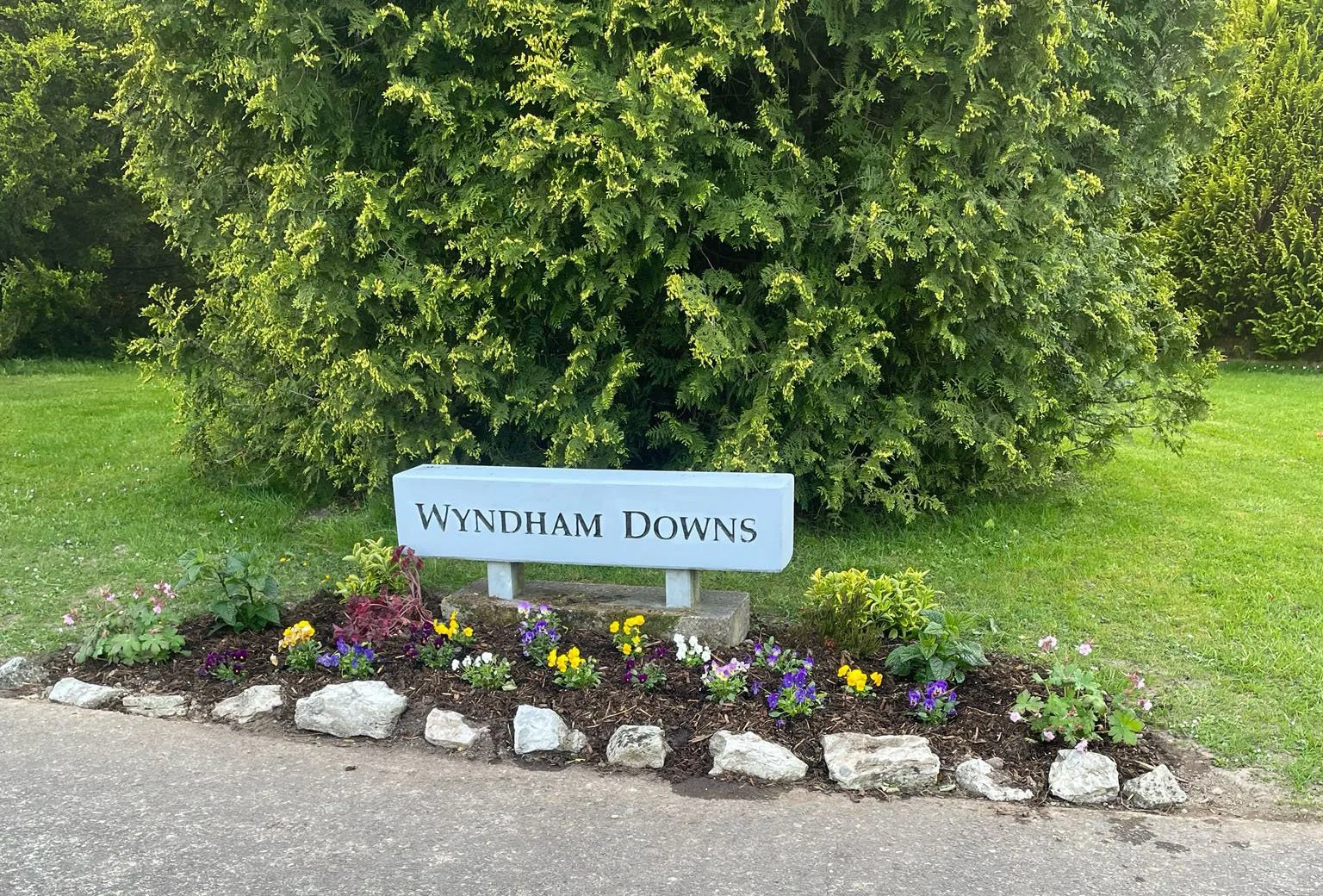 Wyndham Downs estate sign with flowers