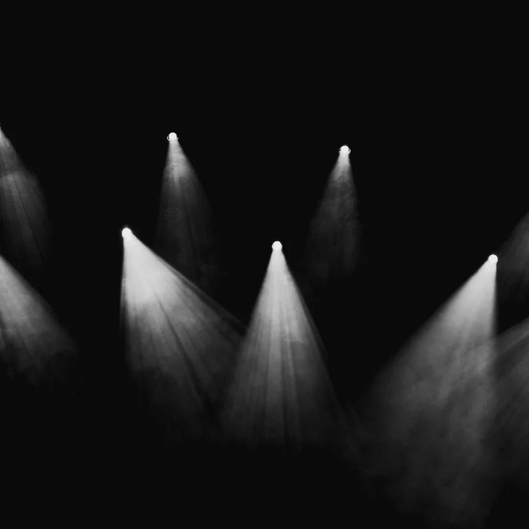a cluster of spotlights on a stage
