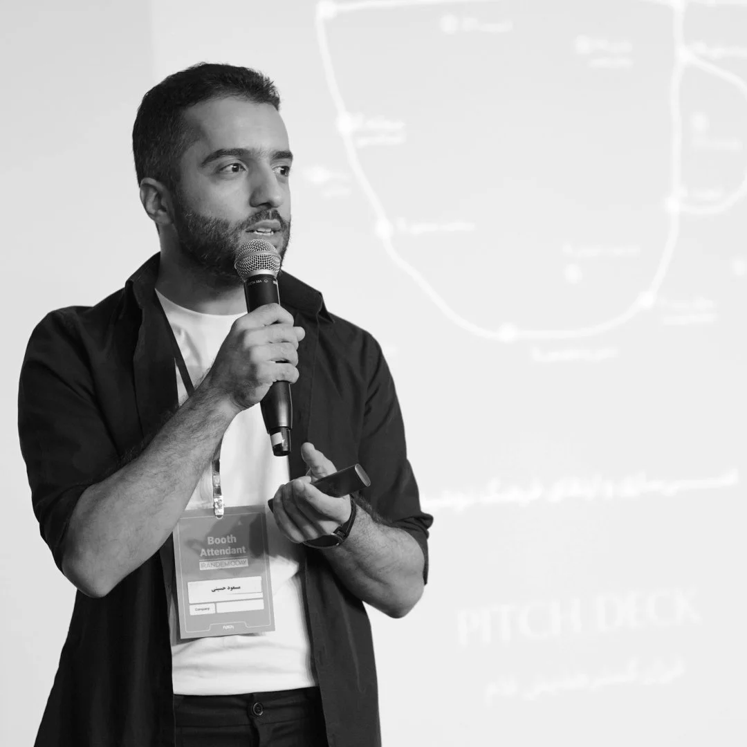 Man standing in front of a screen presenting