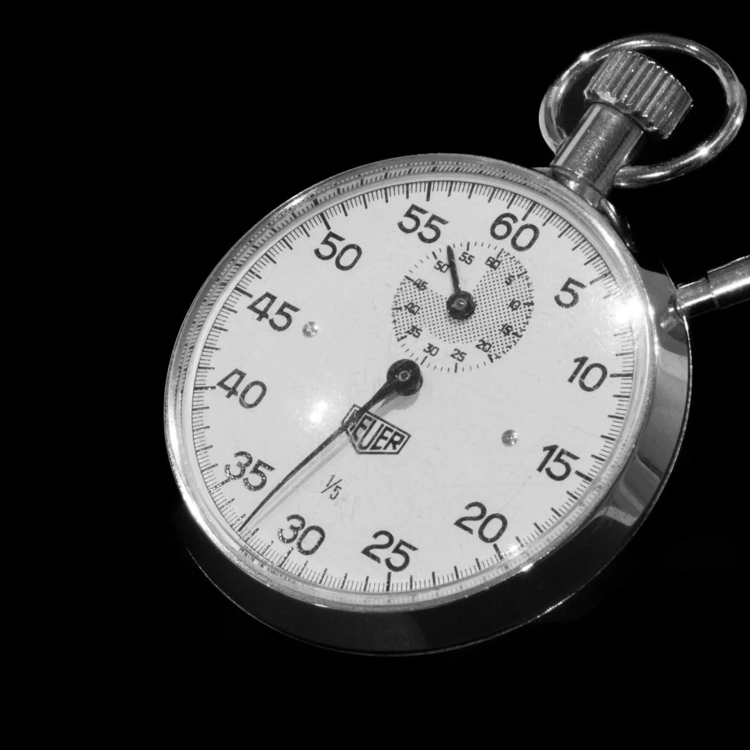 Close-up of a stopwatch, representing time, pace, and fast progress