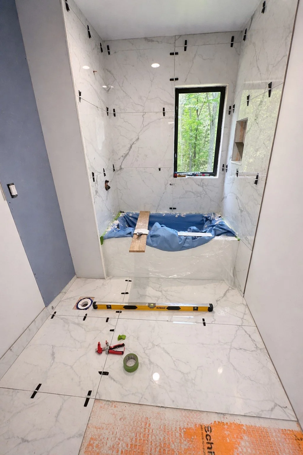 Marble tile installation in progress