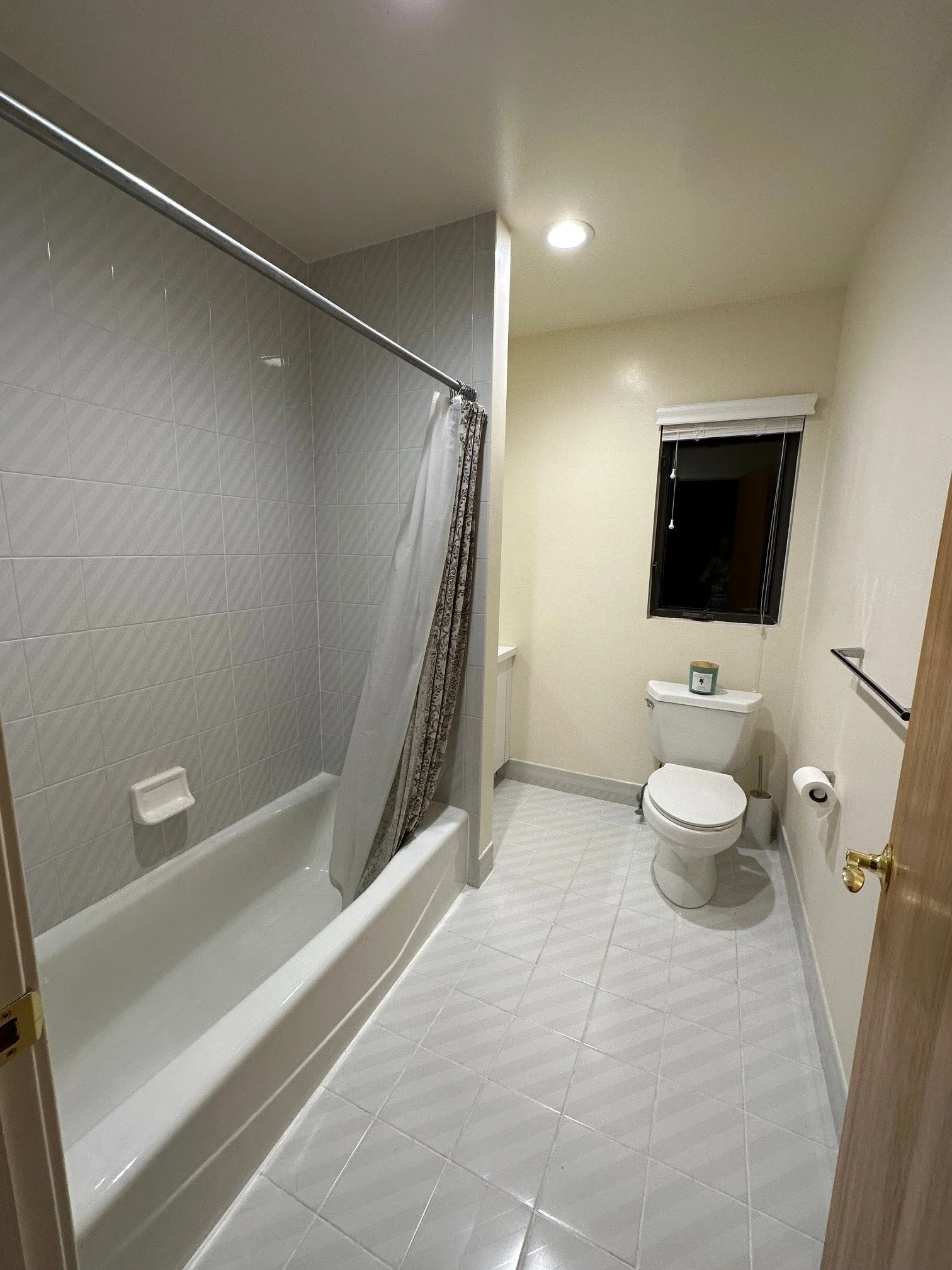1990s bathroom before renovation, looking in
