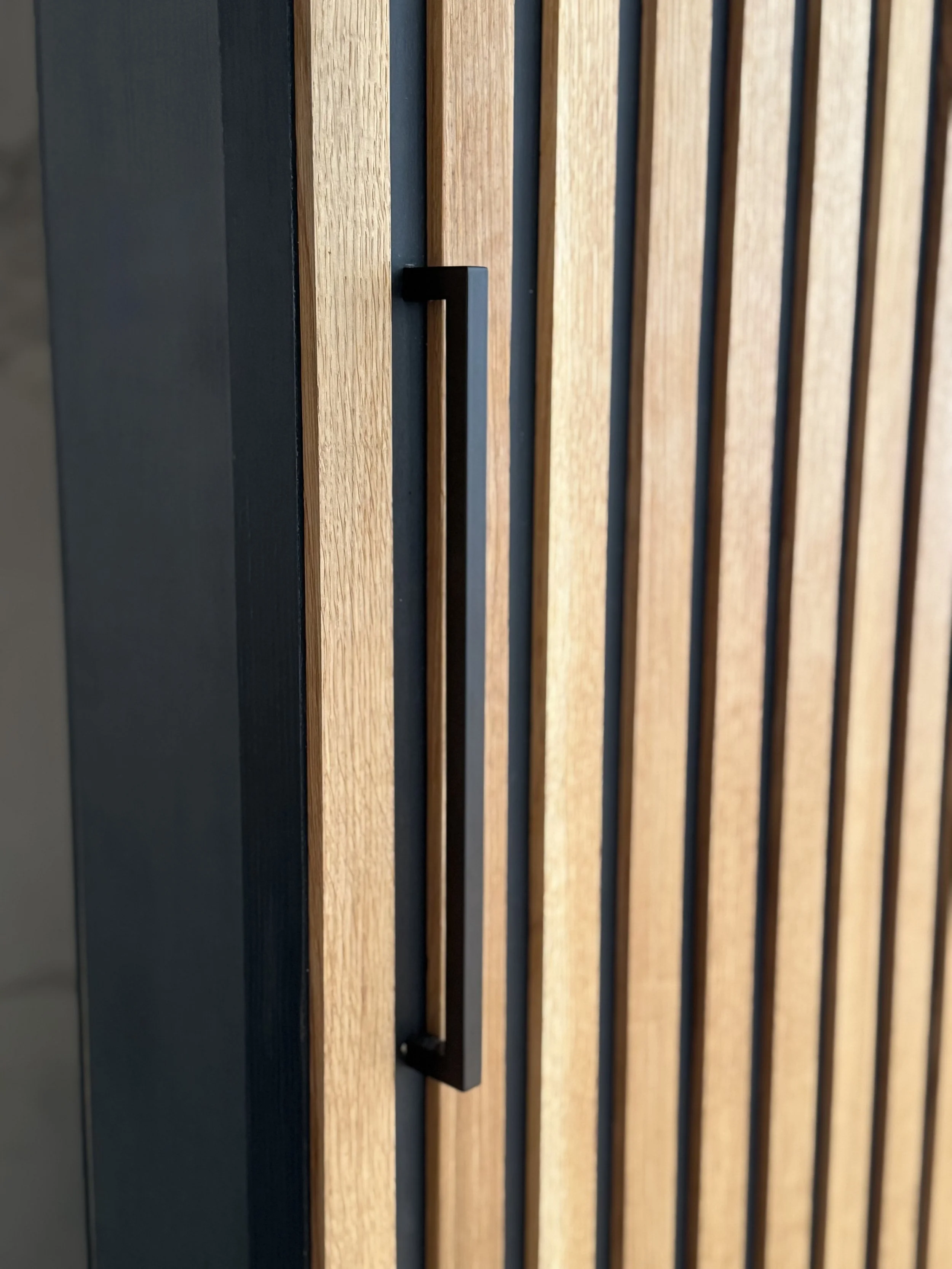 Handle detail of the custom microcement sliding door