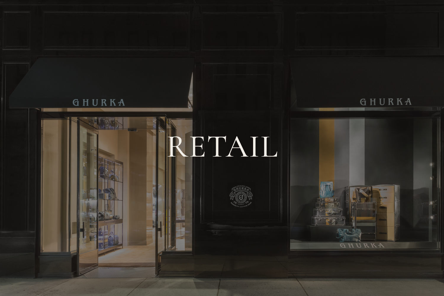 Alexander Mann retail environment design, Ghurka Madison Avenue flagship exterior night, luxury leather goods, New York City