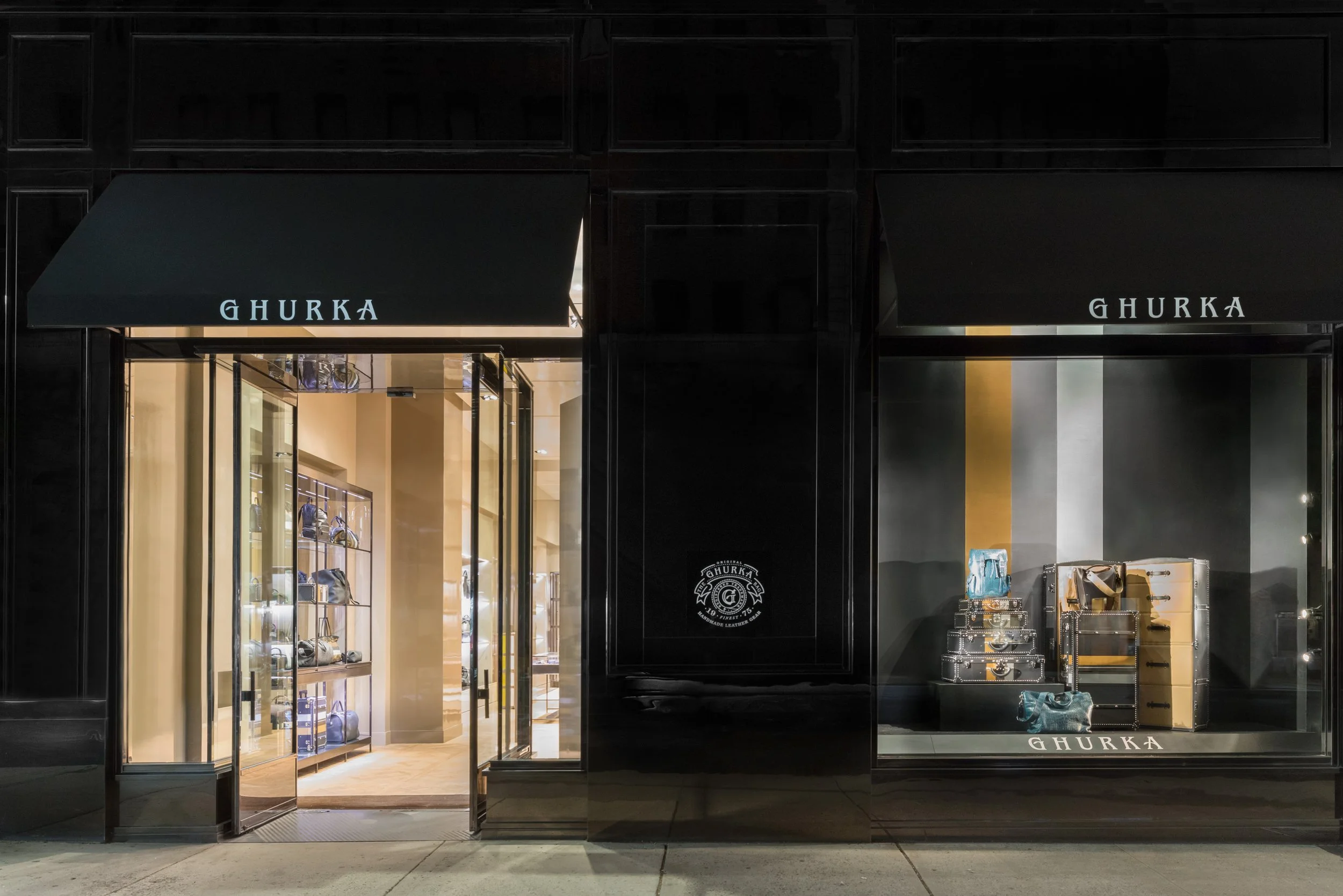 Alexander Mann retail environment design, Ghurka Madison Avenue flagship exterior night, luxury leather goods, New York City