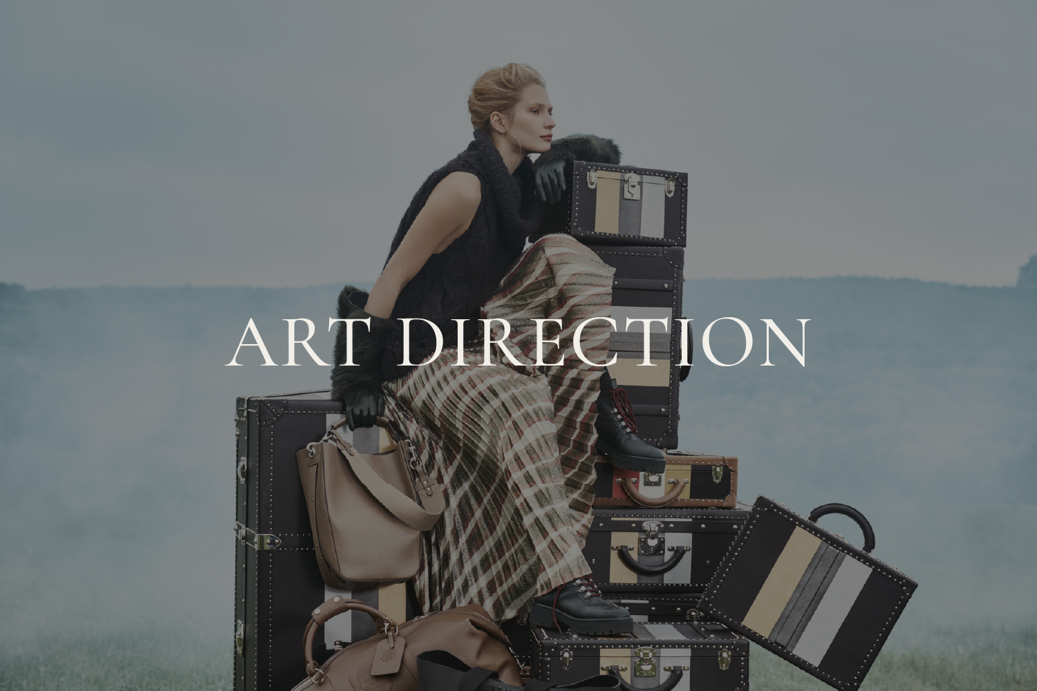 Alexander Mann art direction, Ghurka Mohonk upstate campaign, model on luggage stack, creative director New York