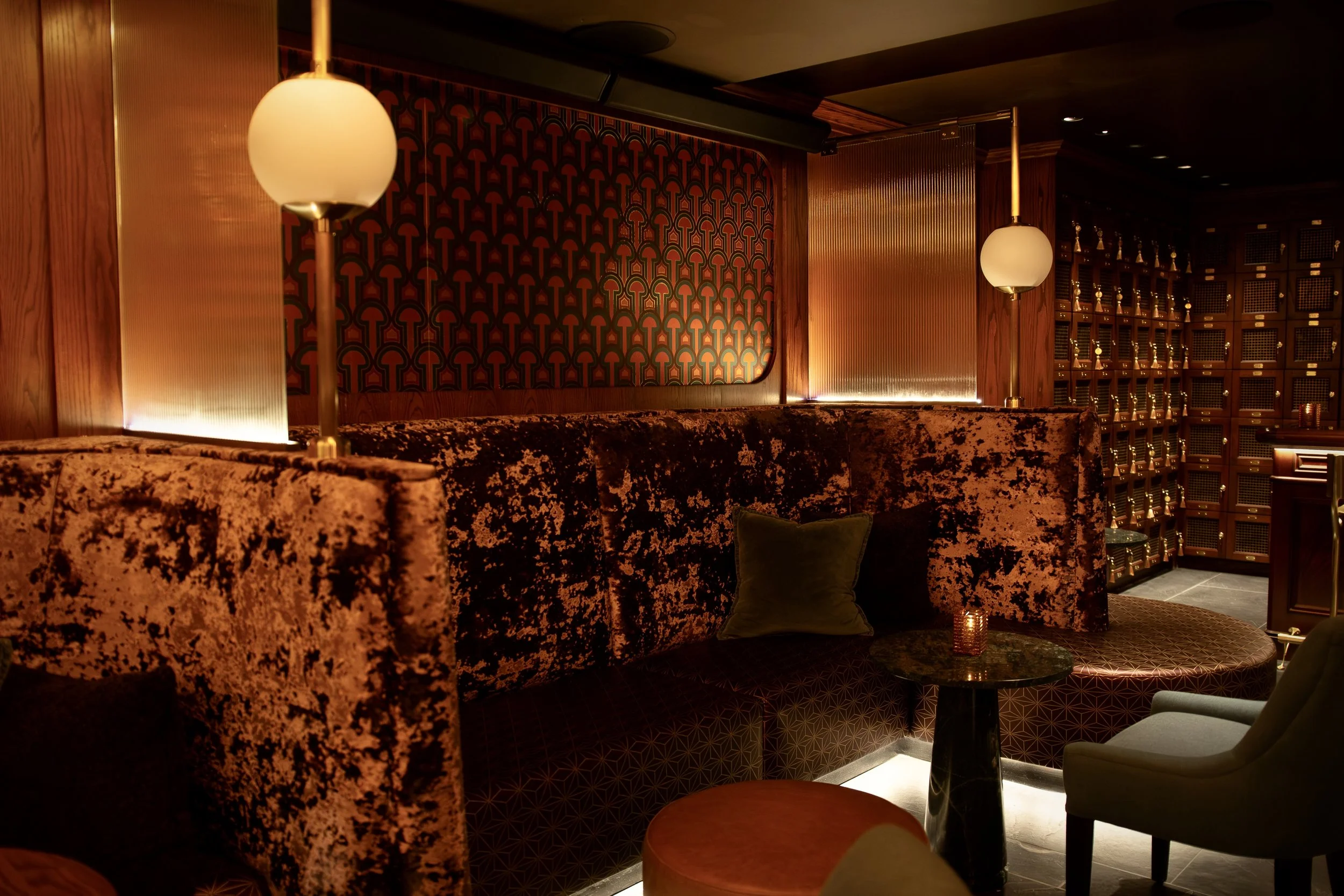 Alexander Mann hospitality interior design, Torches lounge New York, rounded banquette, art deco wallpaper