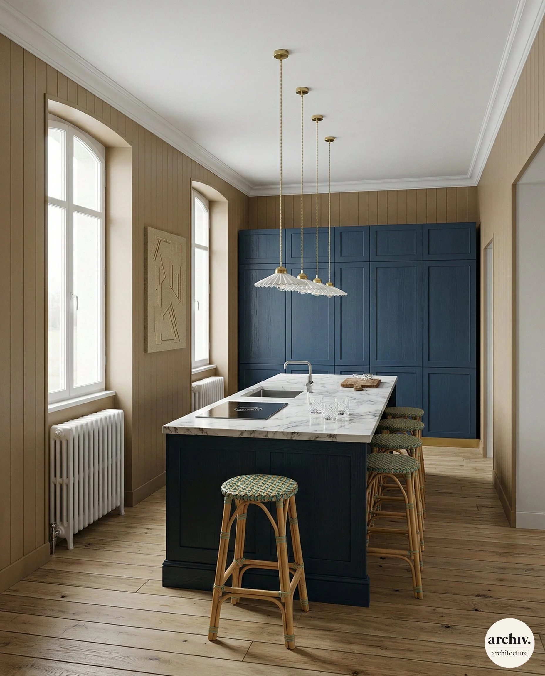 Contemporary kitchen with beige walls, tall arched windows, blue cabinets, island with a white marble countertop, four wicker barstools, hanging pendant lights, and hardwood floors.  Bretagne.