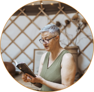 Stephanie reading a meditation in her yoga class in the yurt