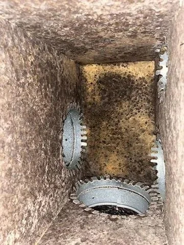 Dirty air duct system with dust and debris buildup before professional cleaning in Coral Springs